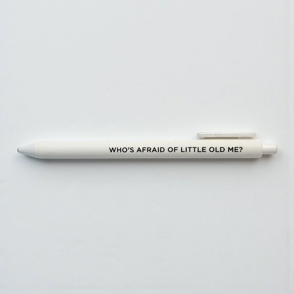 Taylor Swift lyric-inspired pen with “WHO’S AFRAID OF LITTLE OLD ME?” in black text on white barrel.