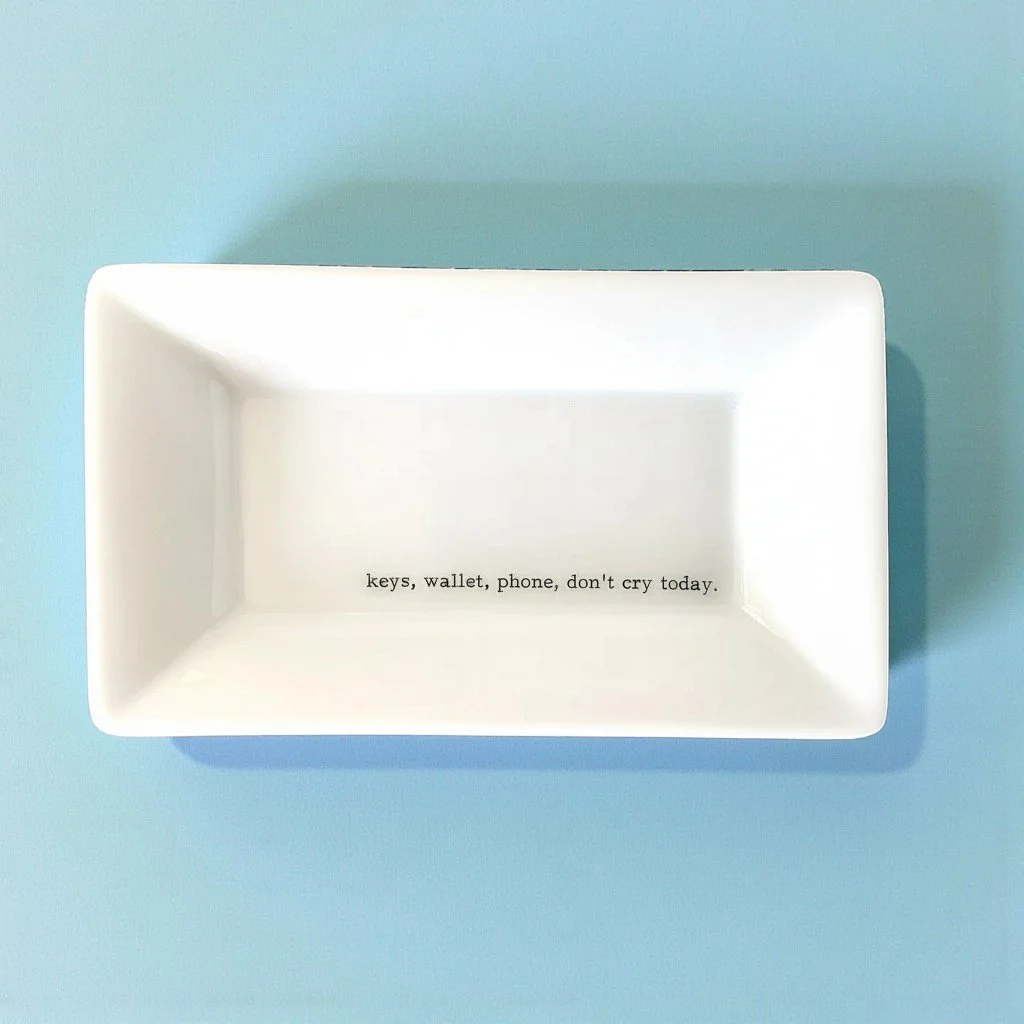 White rectangular ring dish with relatable quote for holding keys, rings, and small essentials.