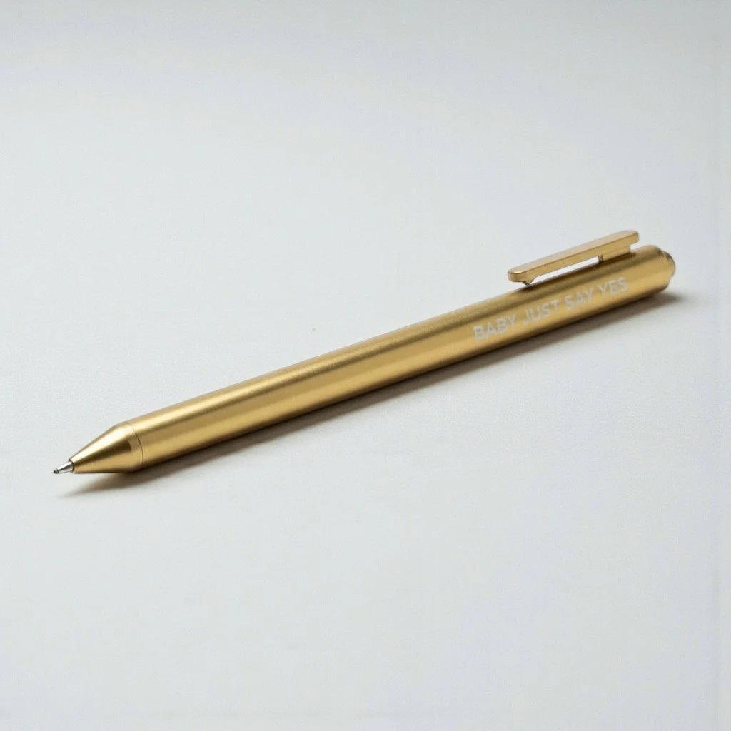 Metallic gold Swiftie pen with romantic quote from Taylor Swift’s Fearless-era hit “Love Story.”