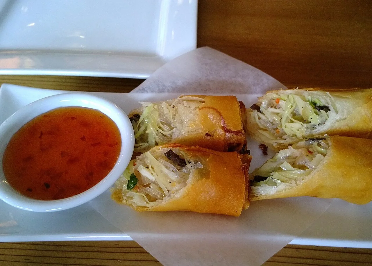 Crispy vegetarian Thai rolls with cabbage and a sweet chili dip