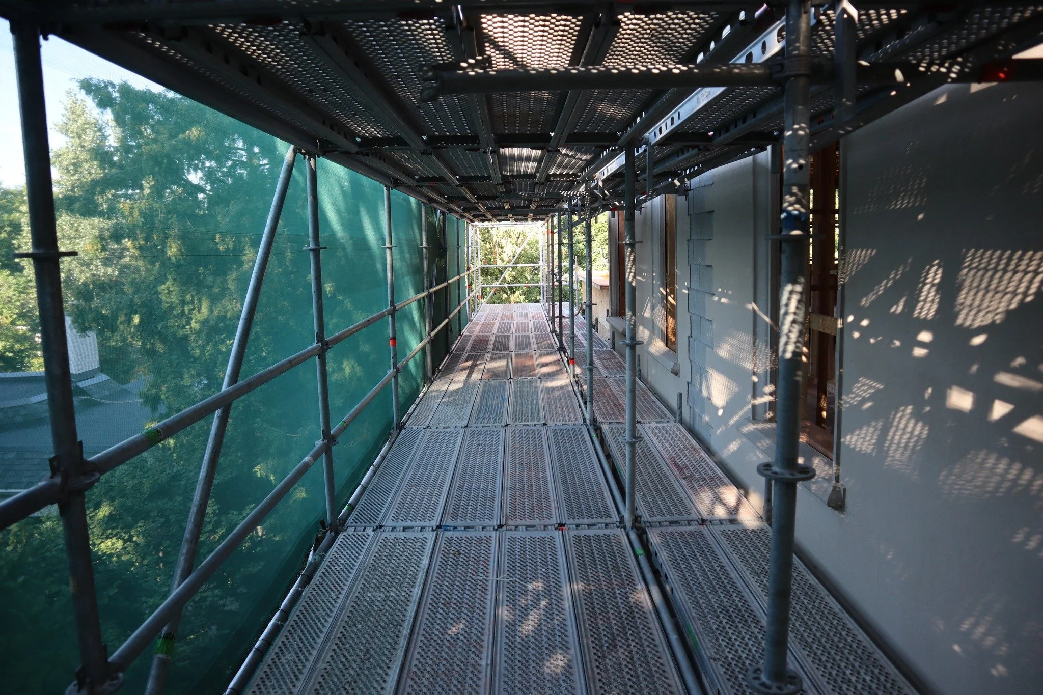 Hello from Forest Hill! We've got the sun shining through on this extensive scaffold setup. This home is undergoing a major renovation, inside and out, and the scaffold will allow safe and comfortable access for several trades. Masonry is up first, g