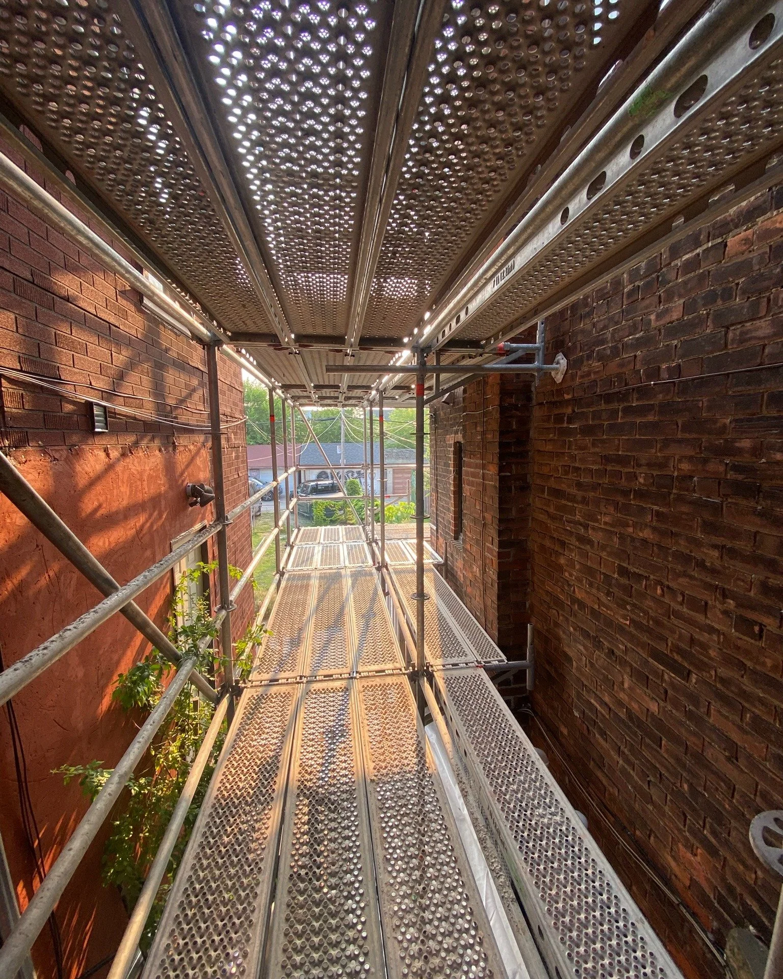 Good morning from Dovercourt Village! Masonry restoration crews were able to reach every section of this extensive heritage repair job with ease thanks to this custom scaffold setup. We specialize in creative and functional scaffolding solutions, esp