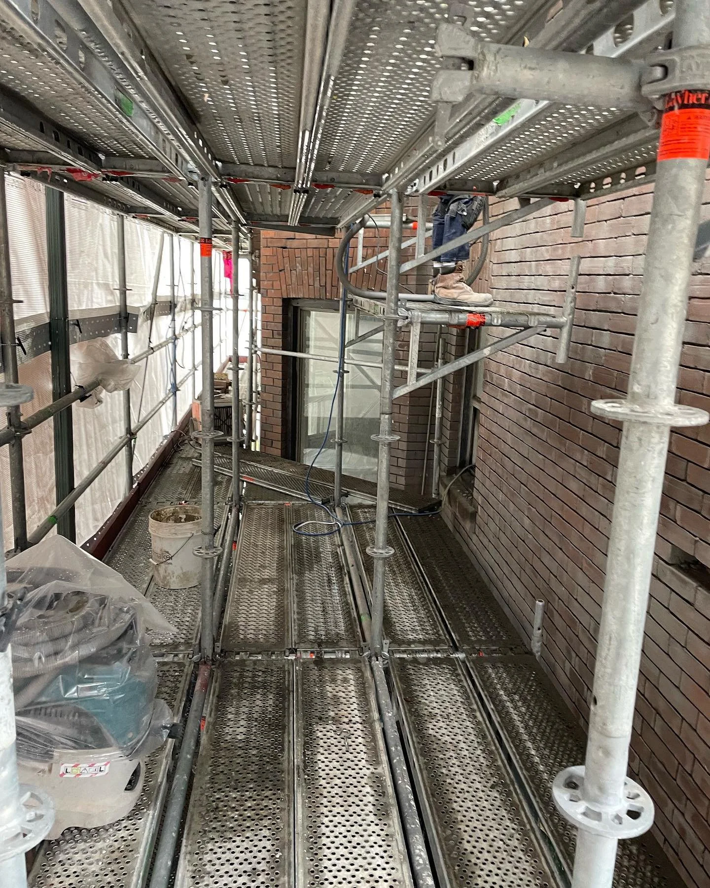 This is what professional scaffolding for accessing restoration work on older homes looks like from the inside.