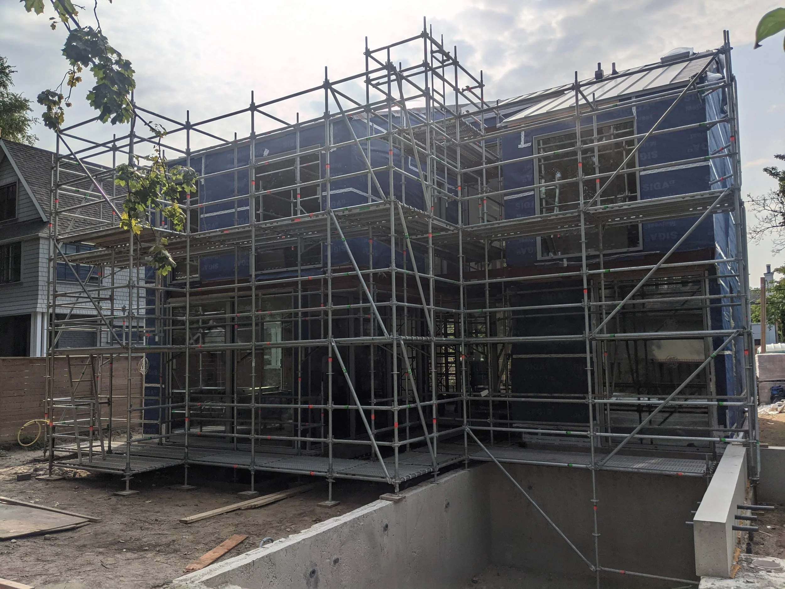 Full house system scaffolding setup with temporary shoring down to in-ground pool level