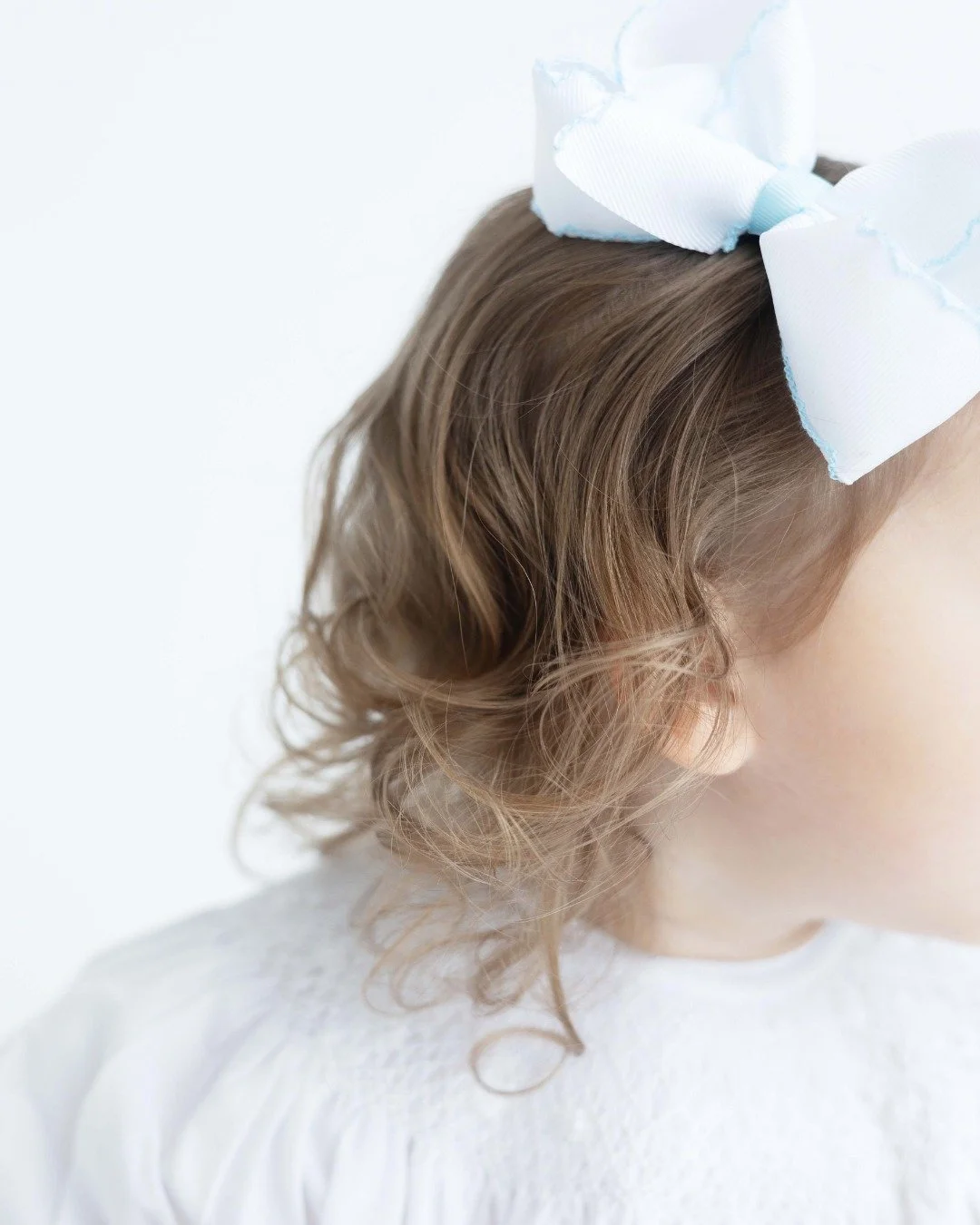 It&rsquo;s the smallest details that fade first.
The curl at the nape of their neck.
The softness of their lashes.
The way their fingers still feel so small in yours.
Heirloom portraits are created to remember these quiet details&mdash;
the ones time