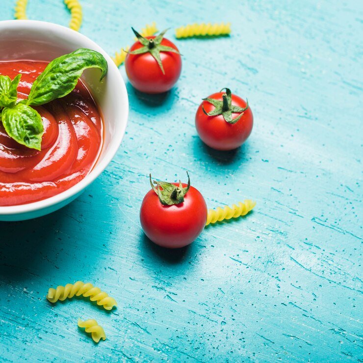 tomatoes-sauce-with-basil-leaf-uncooked-pasta-wooden-background_23-2147922793.jpg