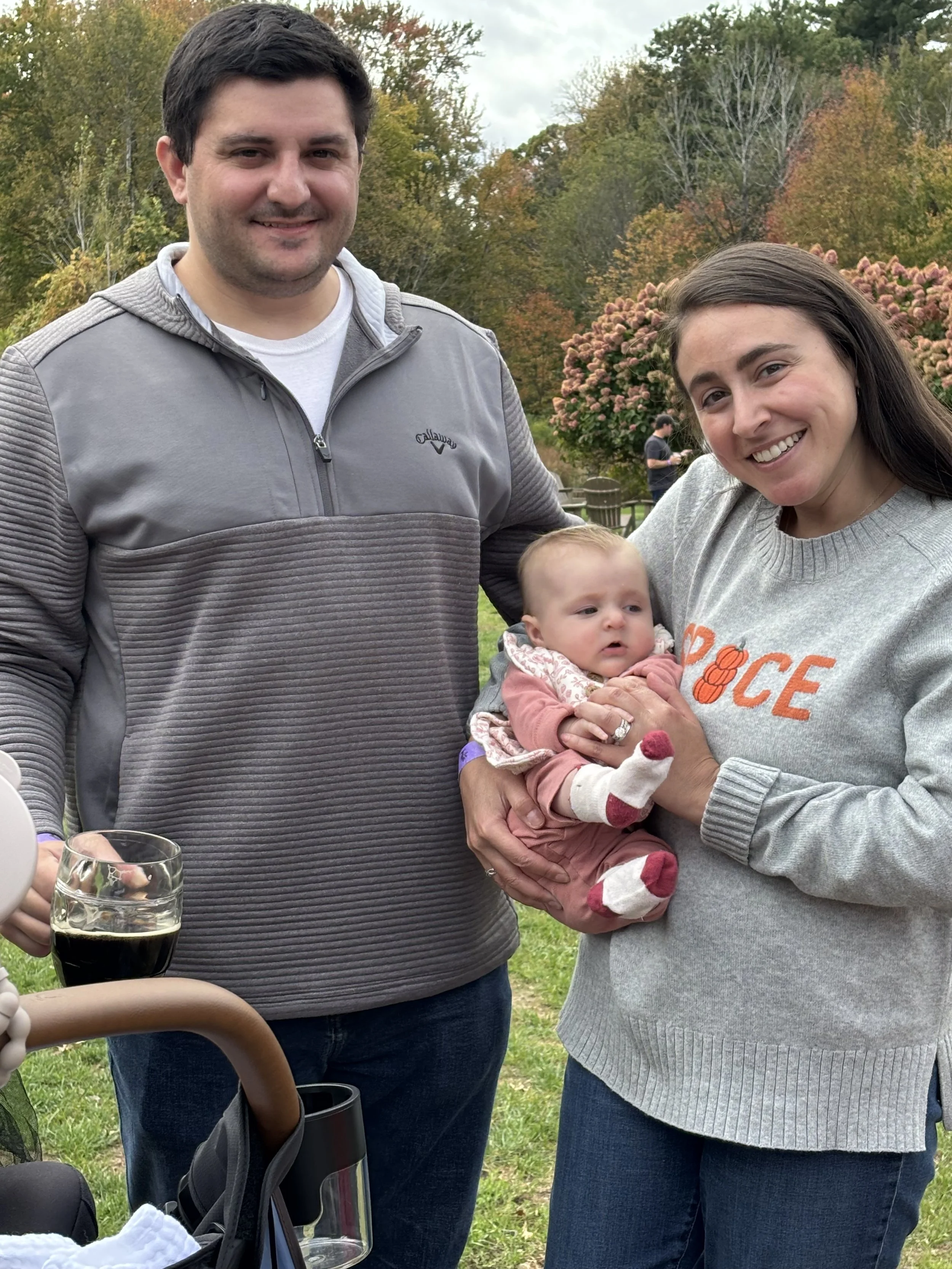 Family photo taken outside.