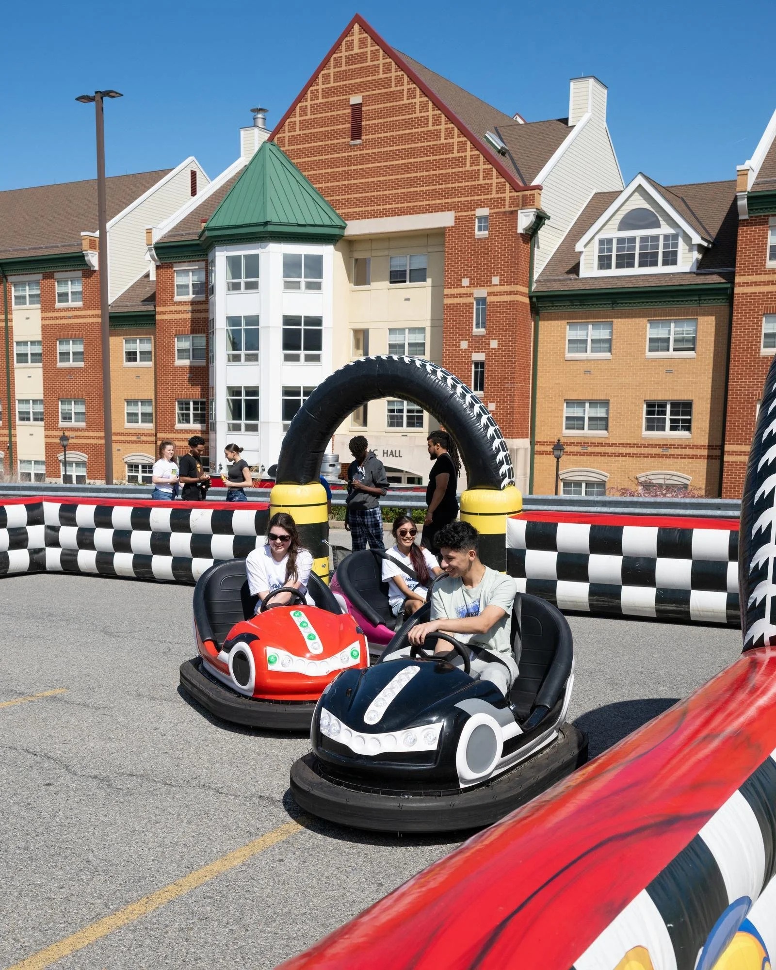   Students enjoyed high-energy attractions like the dunk tank and bumper cars during the annual SGA Block Party.  