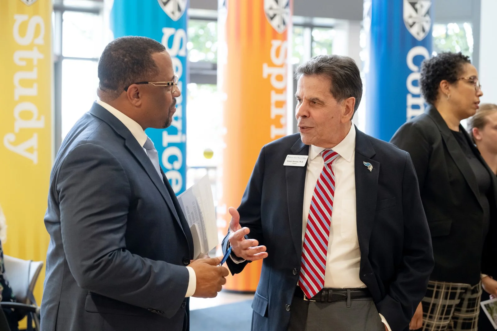   &nbsp;Mount president Dr. Robert Gervasi (right) speaks with Torrance Harvey, City of Newburgh Mayor and 2003 graduate of the Mount.  