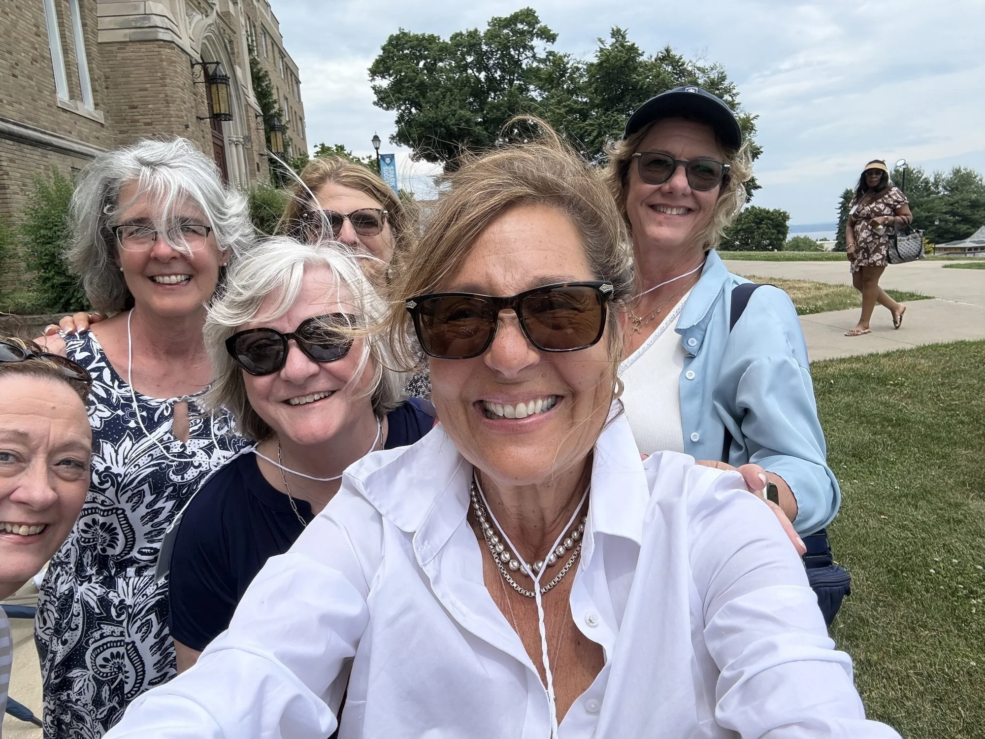 Selfie featuring six women smiling.