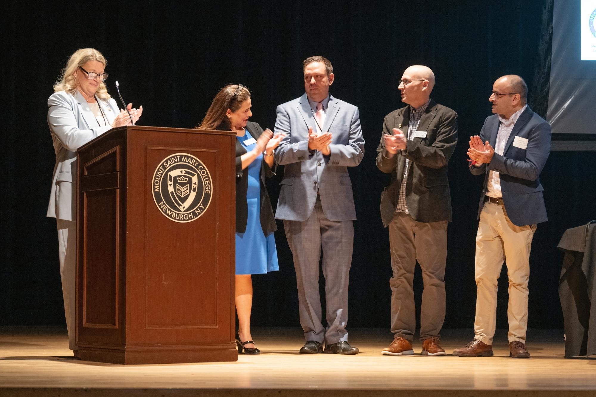 Left to right, Amanda Dana, Orange County Director of Tourism; Nikki Khurana-Baugh, vice president for Advancement at the Mount; Steven M. Neuhaus, Orange County Executive and Mount alumnus; Lee Fothergill, professor of Mathematics; and Sagar Raina