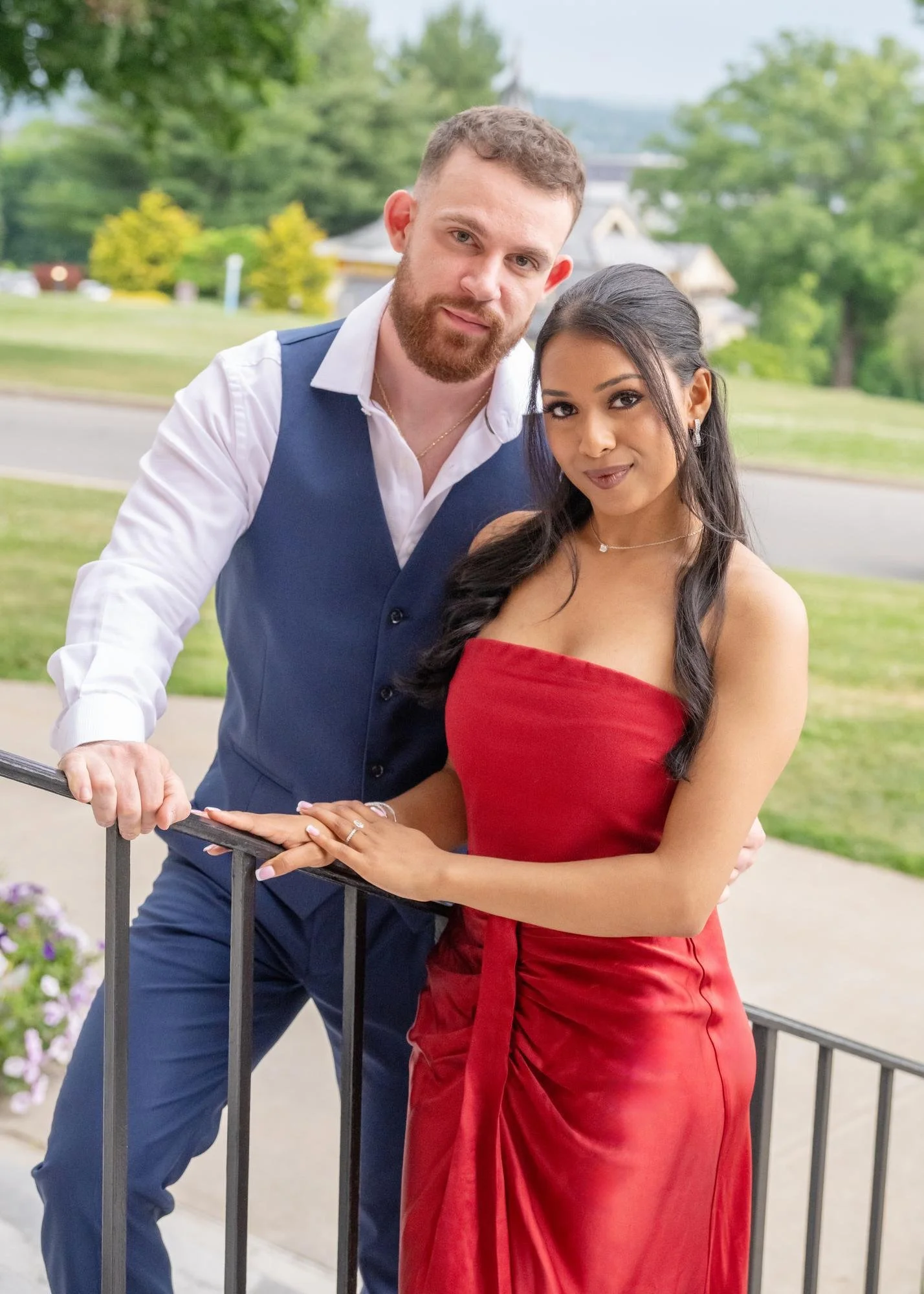 Vincent Martini and Tiara Girdharry pose together on campus after getting engaged.