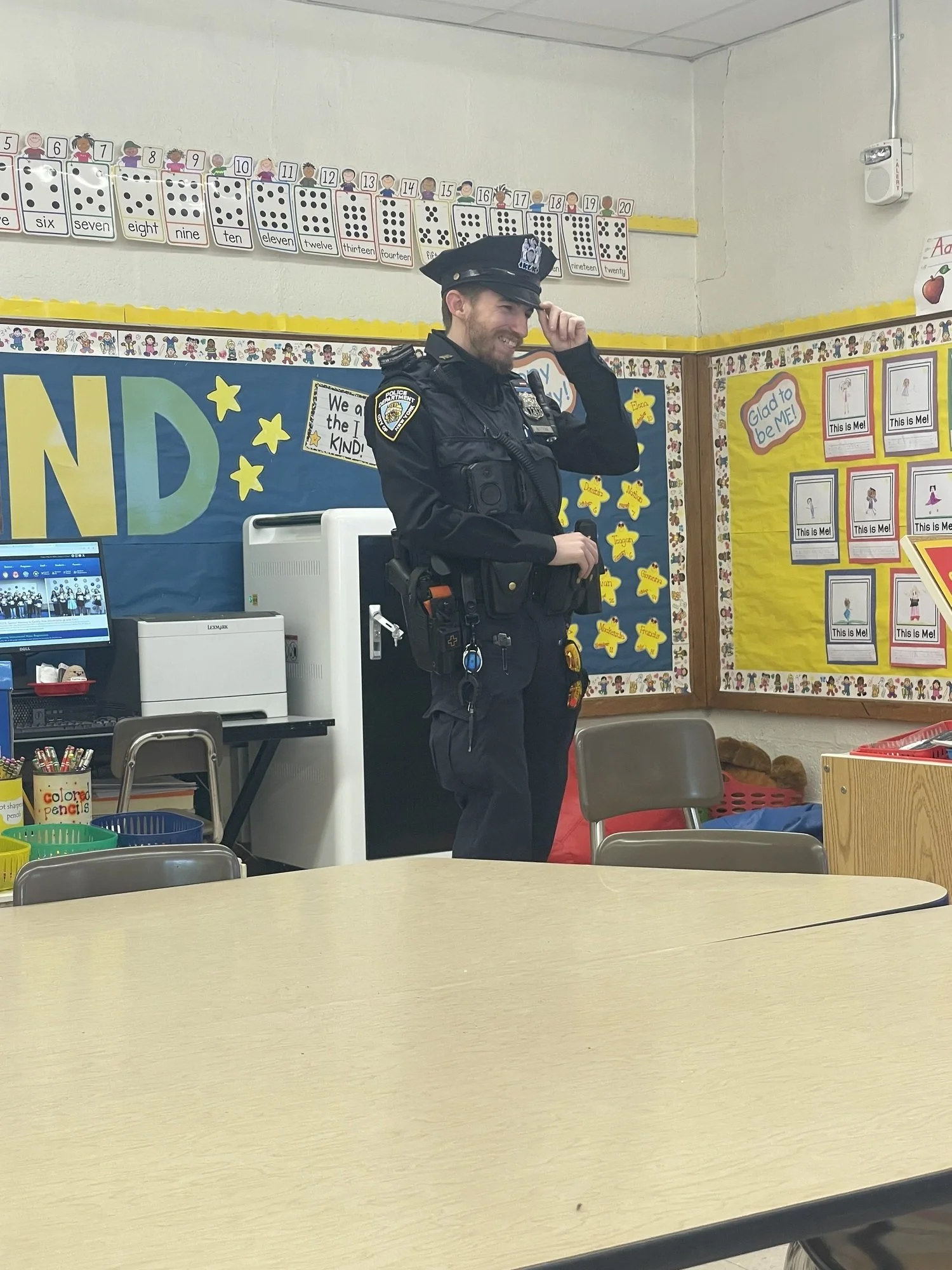 Police officer in a classroom.
