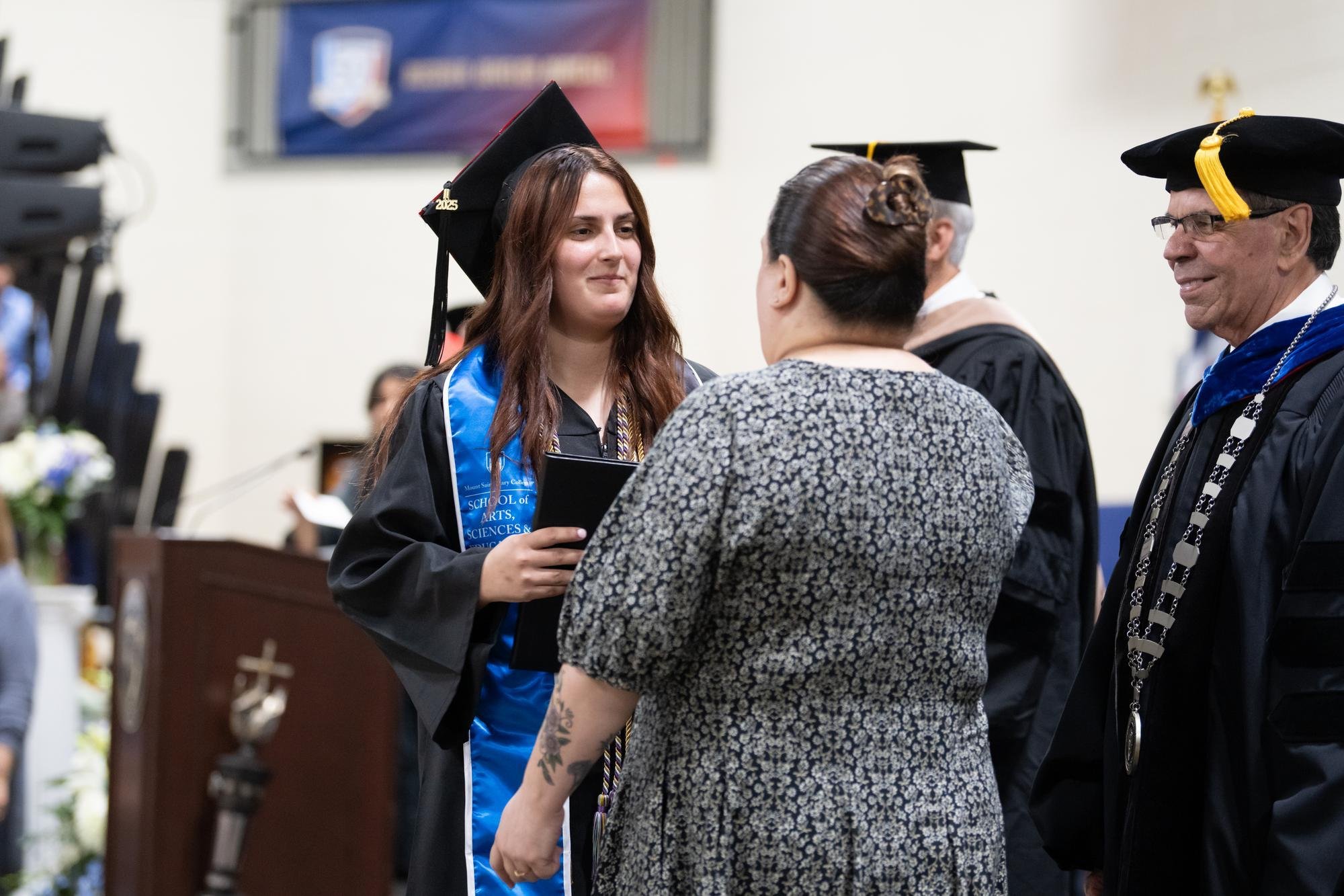 Dylan Weit Lane of Newburgh, N.Y. received her diploma from her mother, Amy Weit, at Mount Saint Mary College’s 62nd annual Commencement ceremony on Saturday, May 17. 