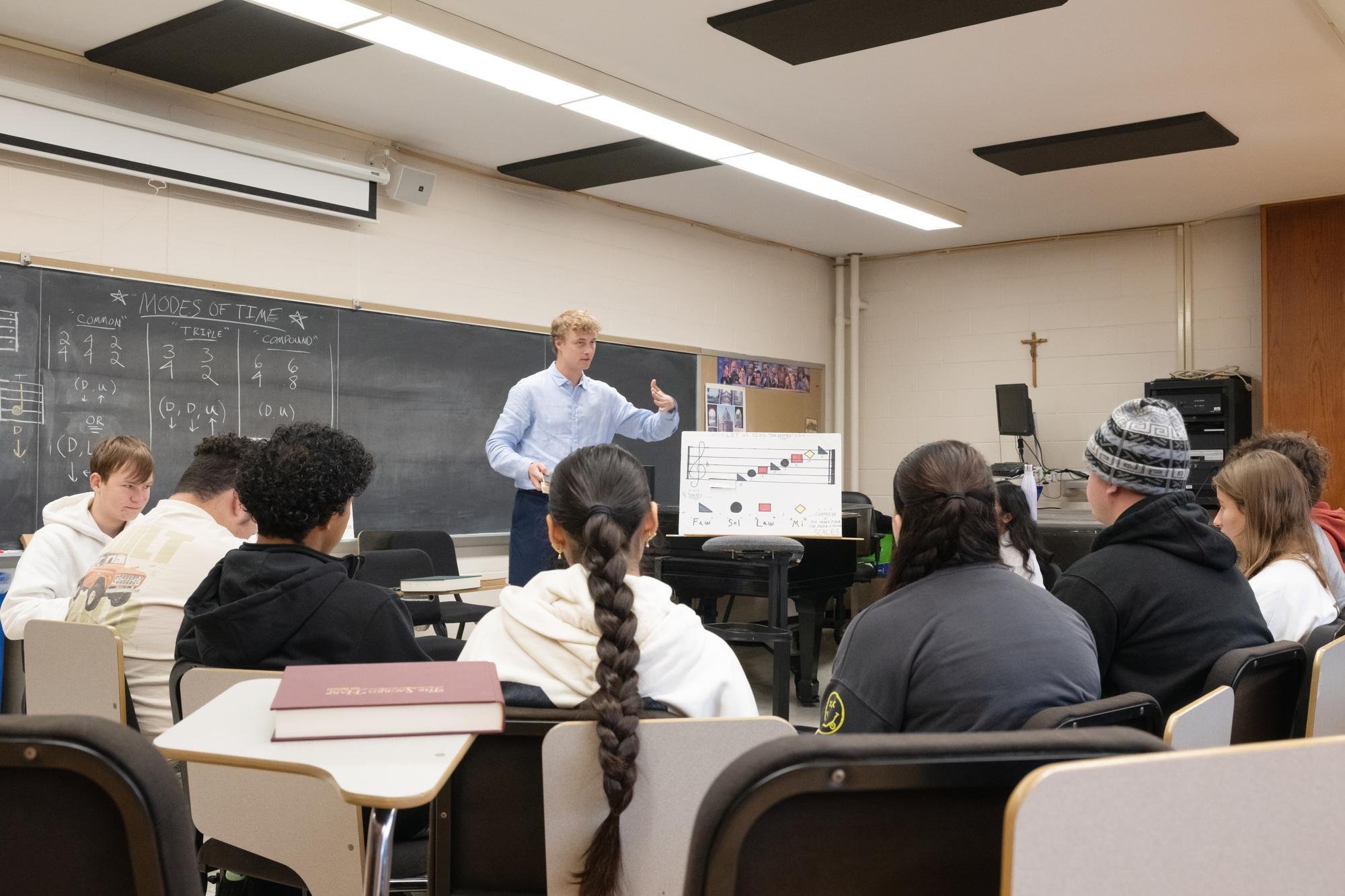 Keillor Mose, an experienced singer and teacher from the Catskills Sacred Harp Association, teaches students how to read traditional shaped note music.