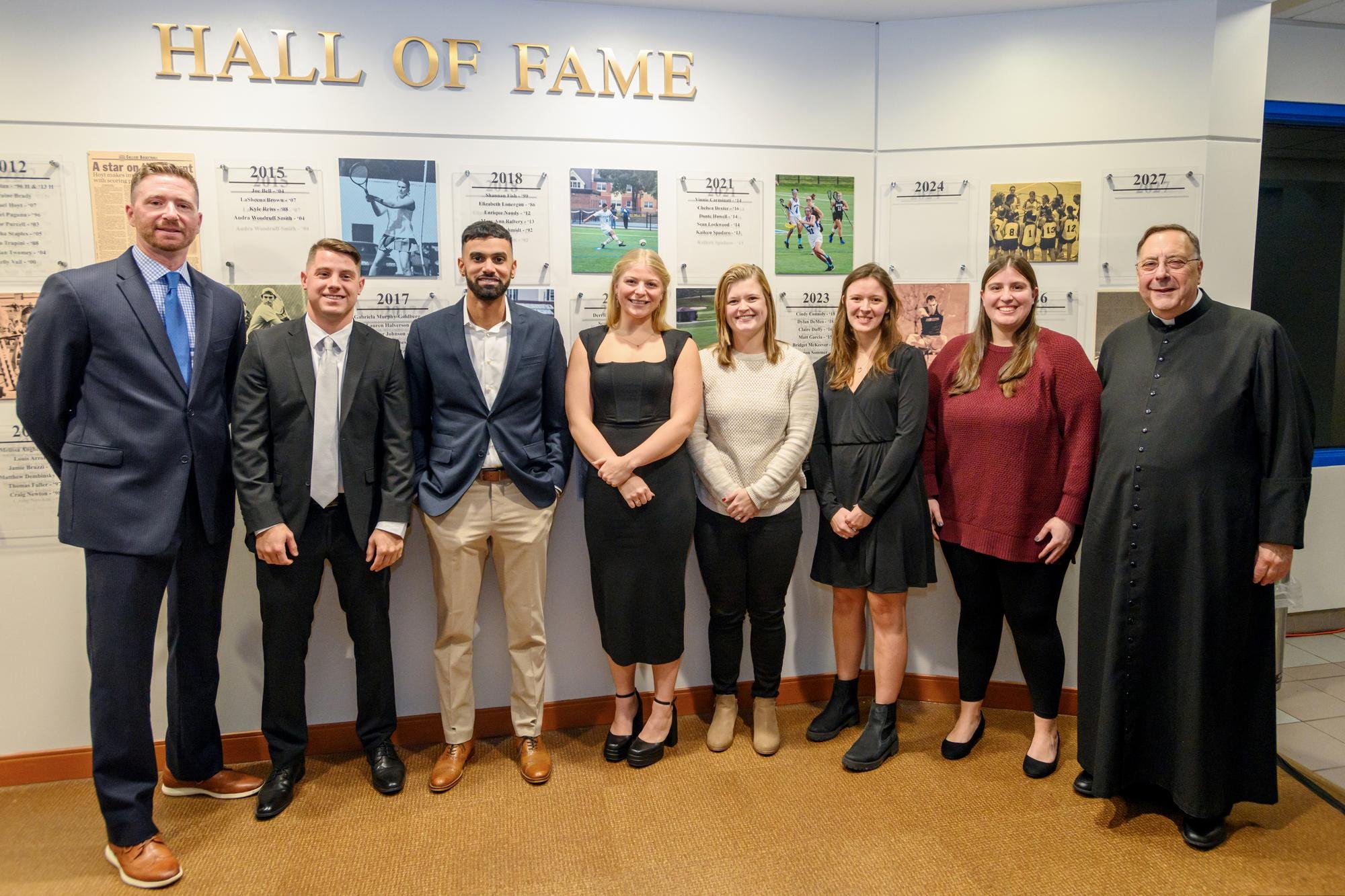   Left to right, Trevor Purcell, Head Baseball Coach; Dylan DeMeo ’18; Matt Garcia ’15; Bridget McKeever ’18; Claire Duffy ’16; Shannon Sommer ’17; Cindy Connoly ’18; and Fr. Gregoire Fluet, Interim President of Mount Saint Mary College.  