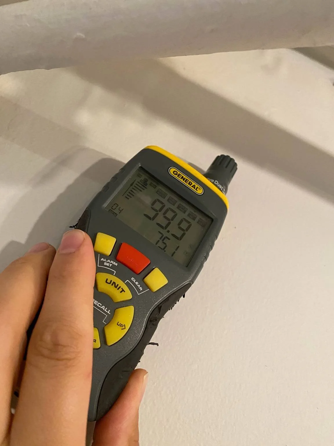 Moisture meter reading showing elevated moisture levels during a mold inspection