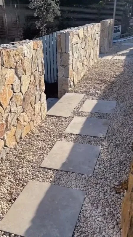 Full landscape construction completed in Seaforth, incl sandstone retaining walls, cladded block walls, irrigation, planting, grass, drainage, stepping stones, etc