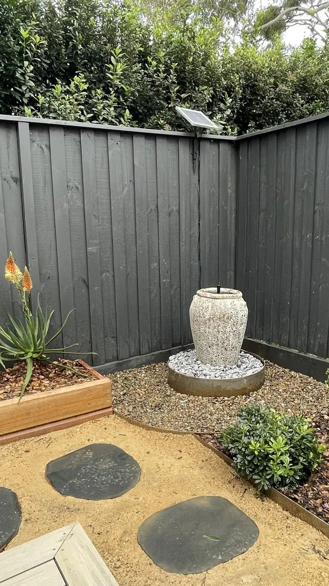 A small backyard transformation with decking, planting, garden beds, water feature, stepping stones, etc in Marsfield