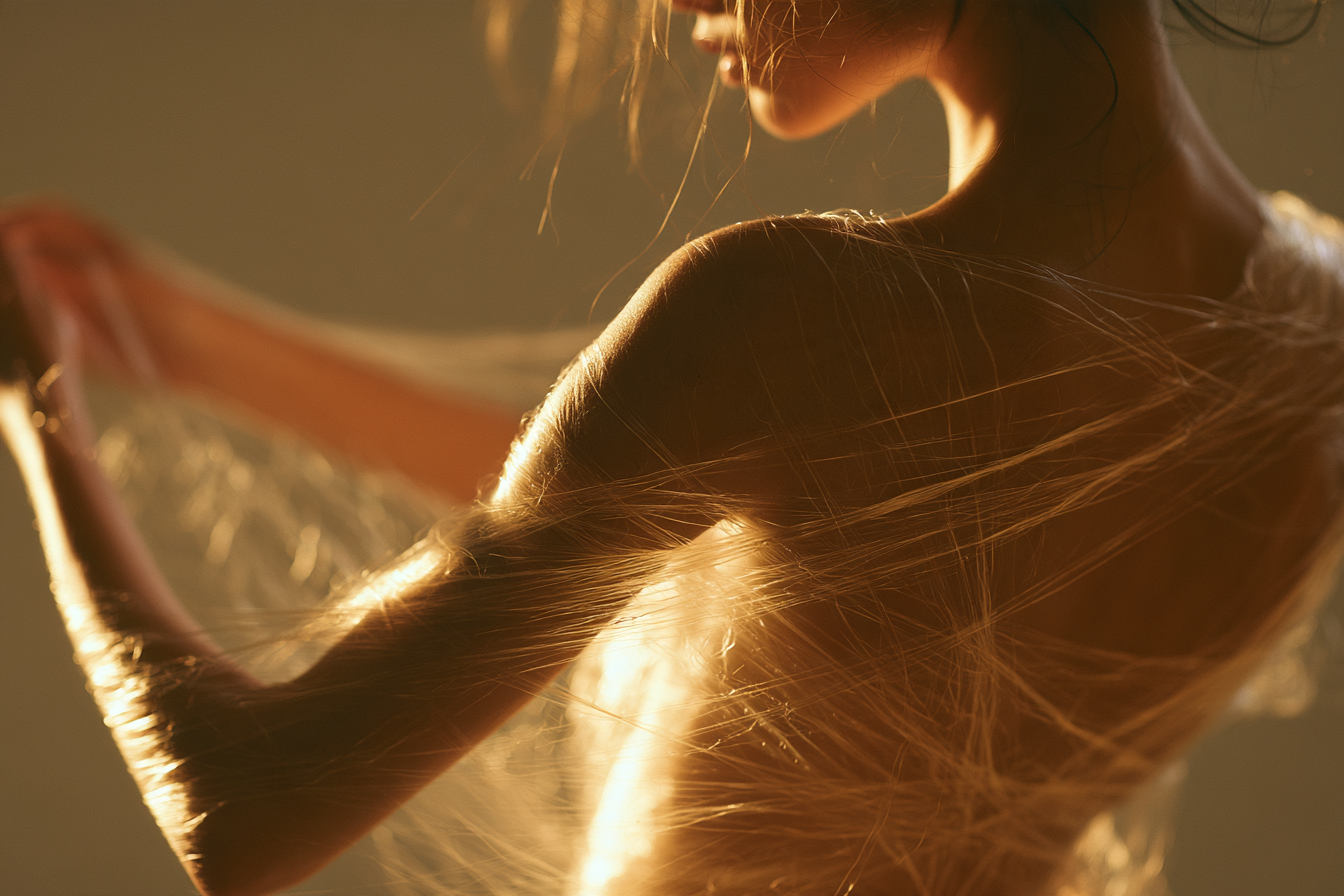 Woman gently unraveling threads around her body, symbolizing healing religious sexual shame after purity culture.