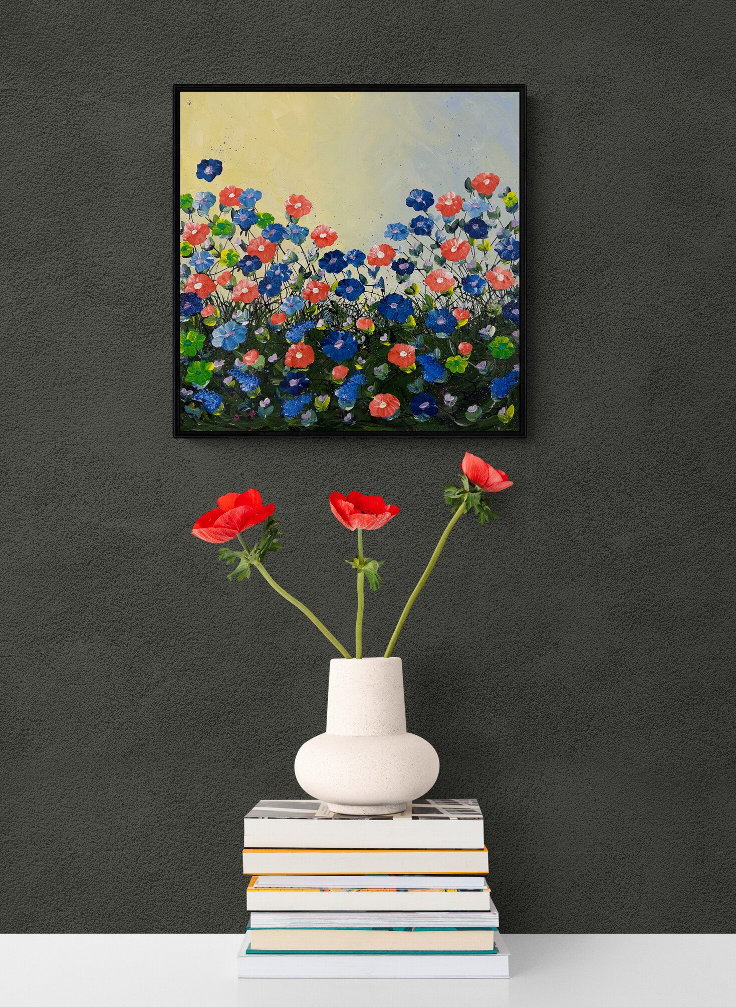 red-flowers-in-a-vase-sitting-on-books-2.jpg