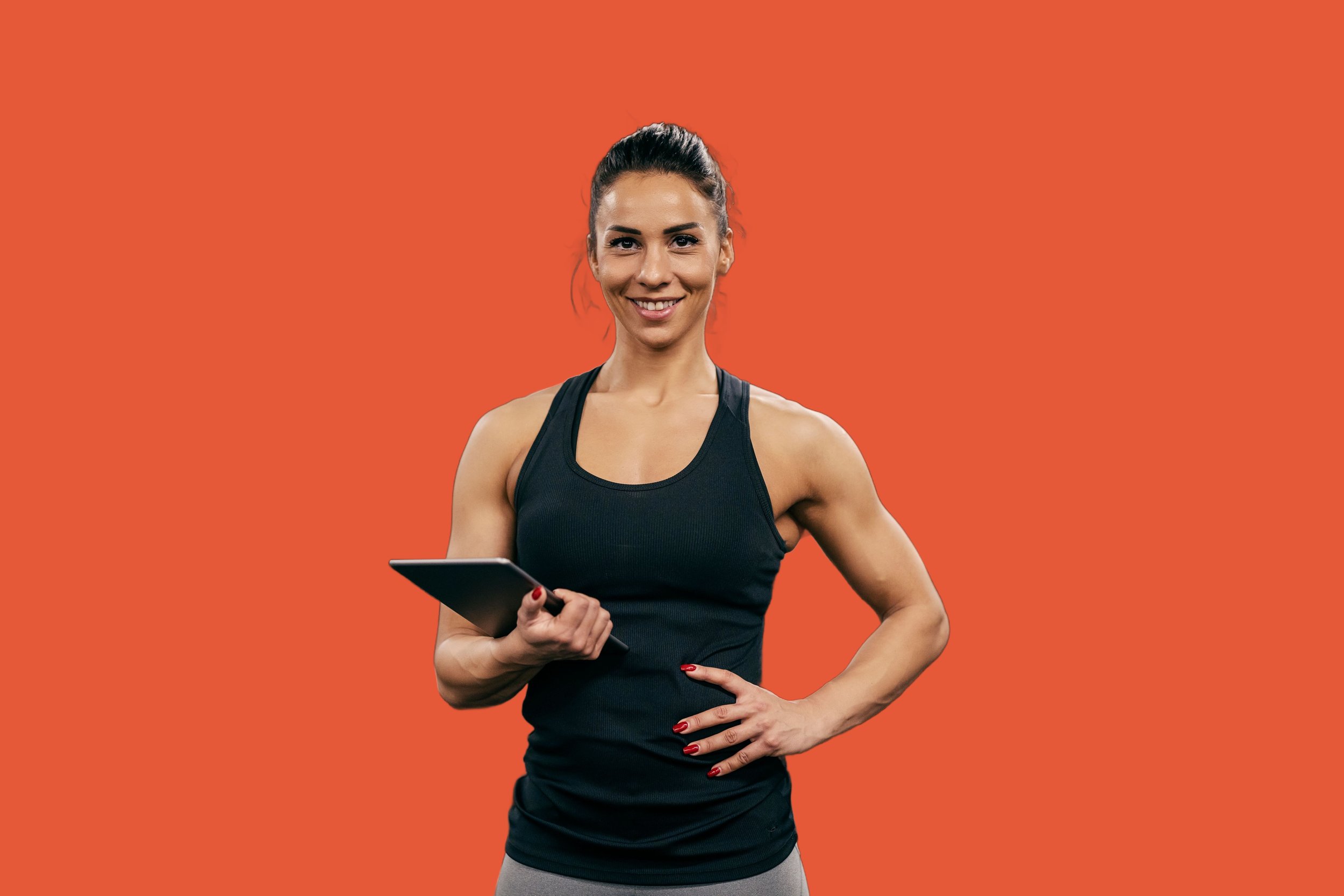 Female personal trainer orange background.jpg