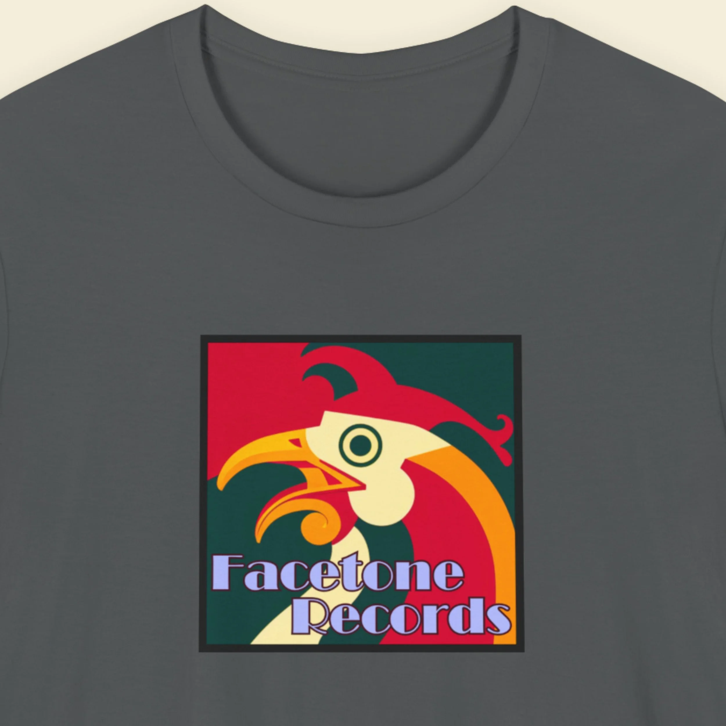 Gray t-shirt with a colorful rooster graphic and 'Facetone Records' text on a beige background.