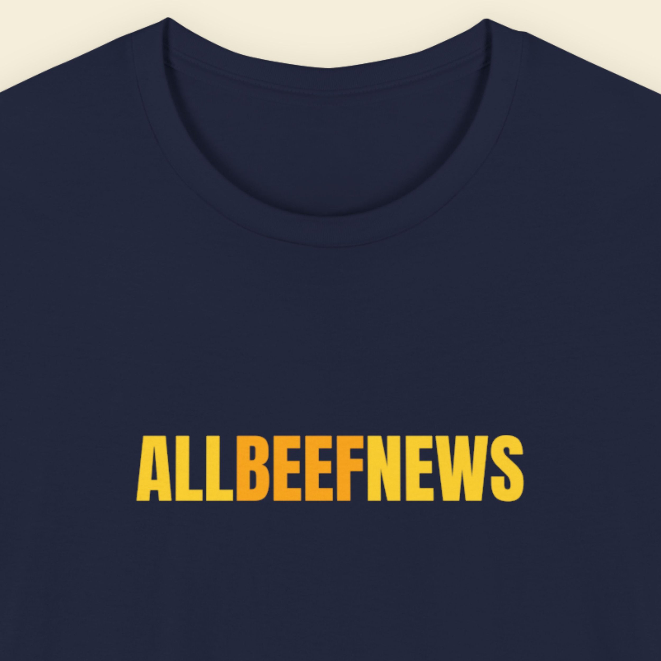 Navy blue t-shirt with humorous colorful ALLBEEFNEWS text on a beige background.