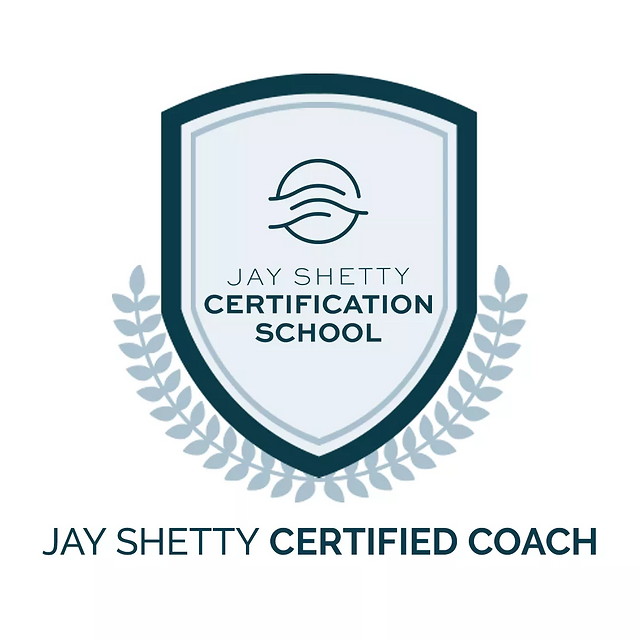 A certification badge for Jay Shetty Certification School, featuring a shield with a wave and circle logo, surrounded by laurel branches, and the text "Jay Shetty Certification School" and "Jay Shetty Certified Coach".