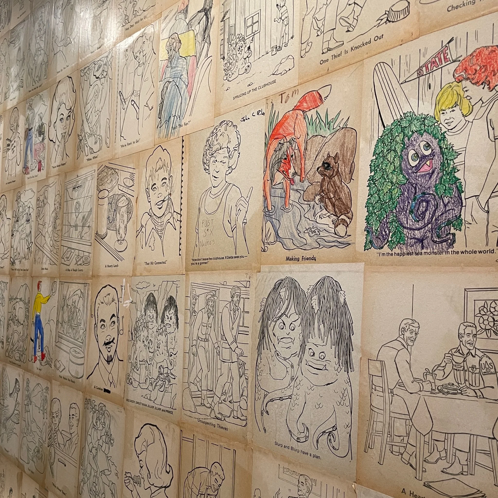 A collage of black-and-white and colored comic-style illustrations depicting various scenes and characters, including animals, people, and humorous scenarios.