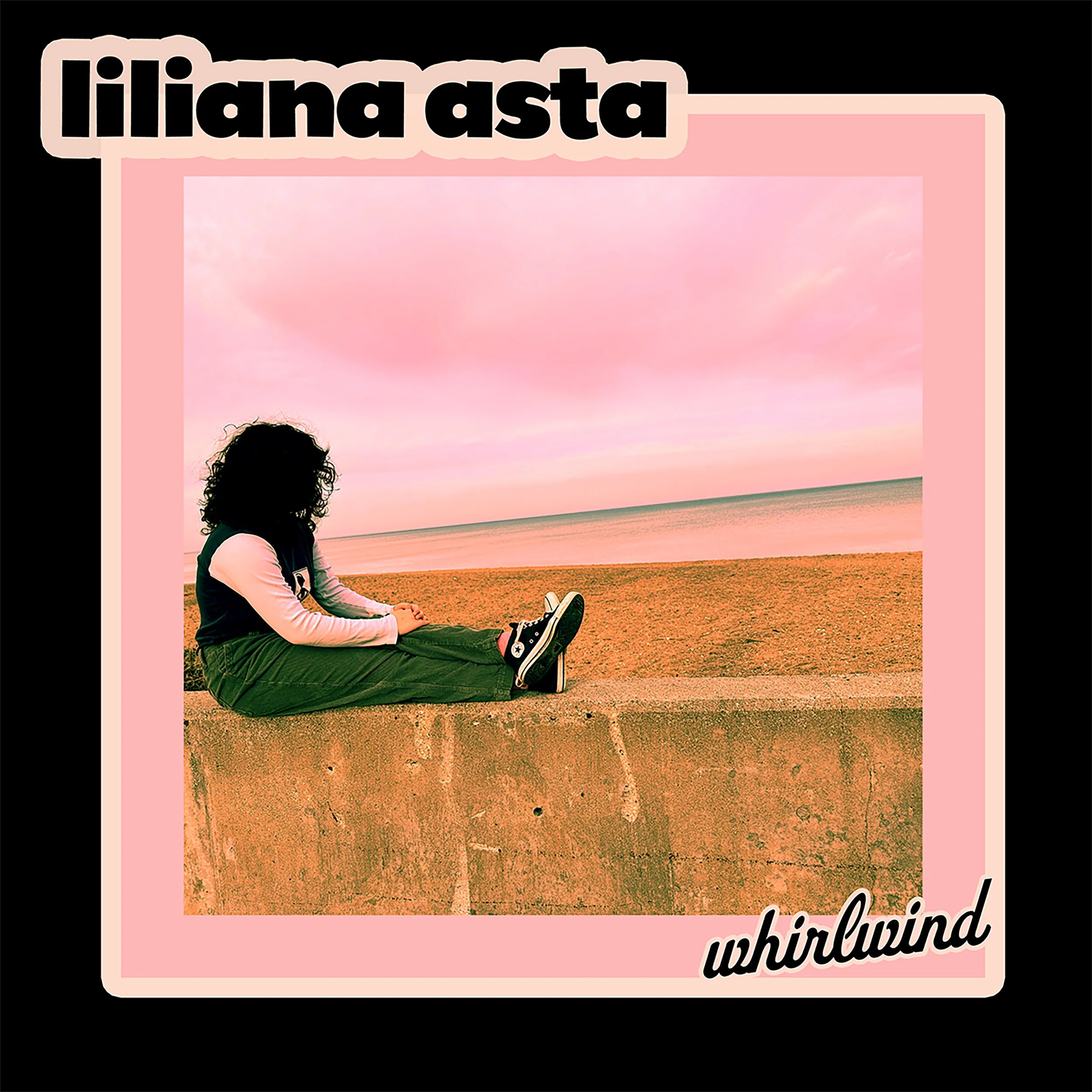 A person with curly hair sitting on a concrete ledge by the beach, looking at the pink sky and water at sunset, with the text 'lilianna aste' at the top and 'whirlwind' at the bottom right corner.