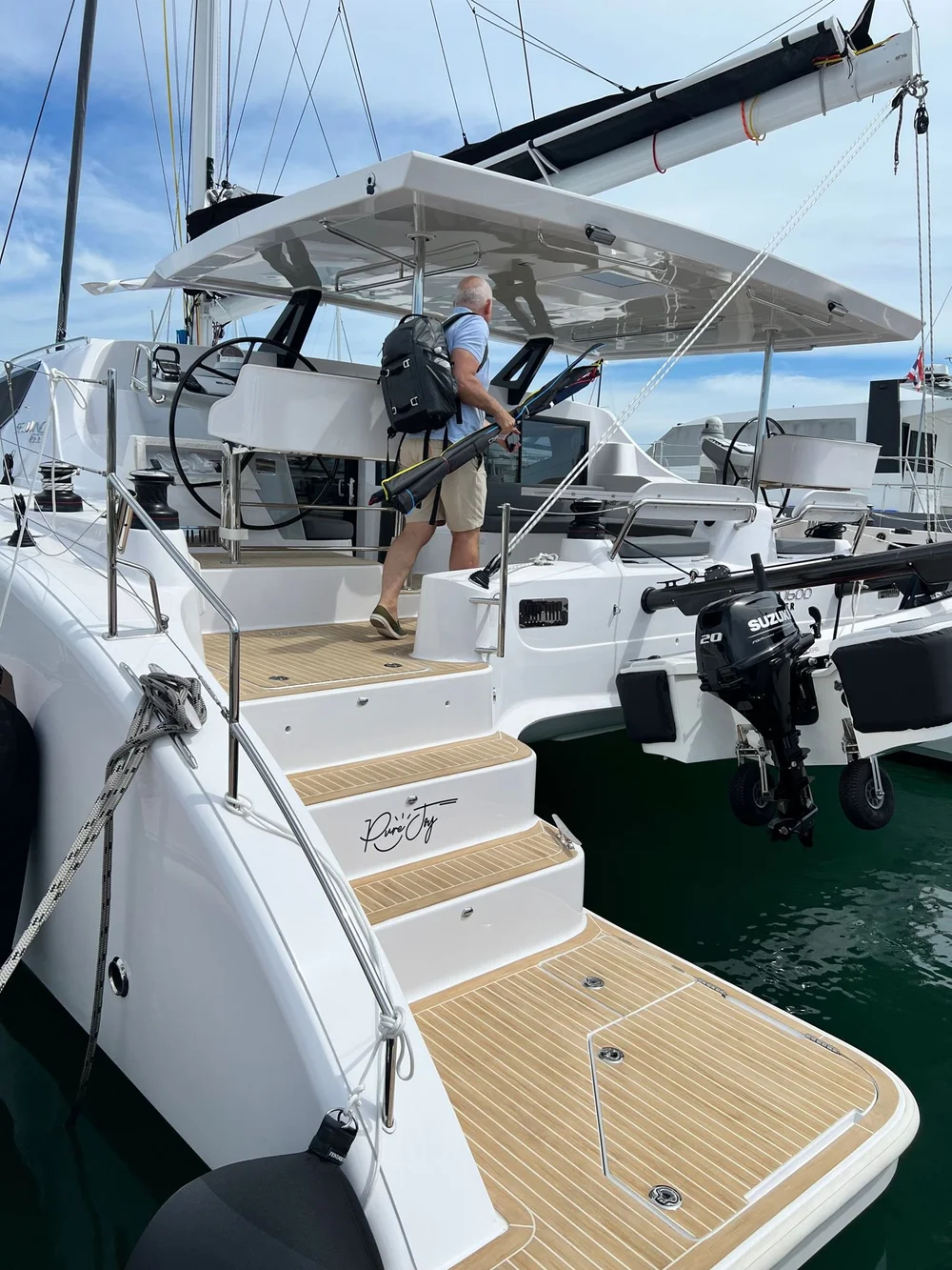 Carrying a bunch of fishing gear we have no idea how to use!