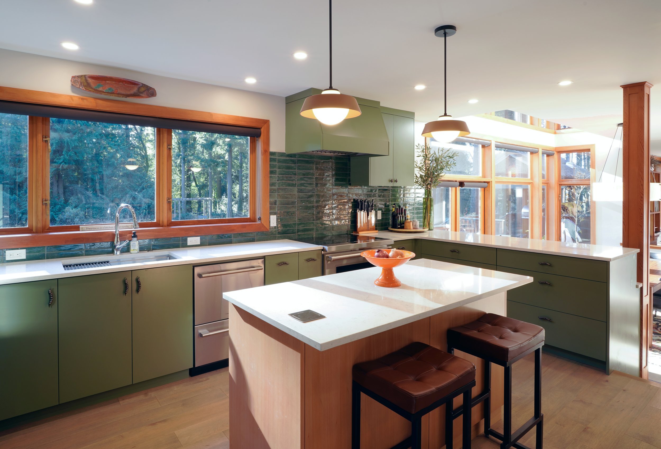 Custom kitchen cabinets, hood, and island with tile backsplash, Bainbridge Island - Vega Builder