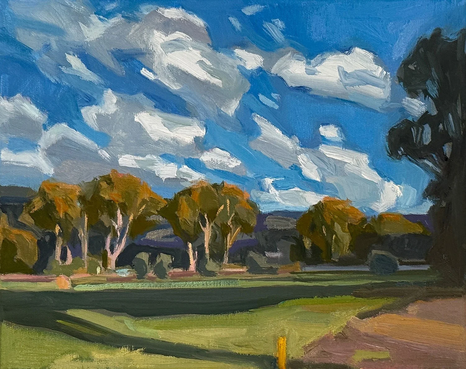 A landscape painted in an impressionist style, featuring a sky with white clouds, a row of trees with orange and green foliage, and a grassy field with a dirt path in the foreground.