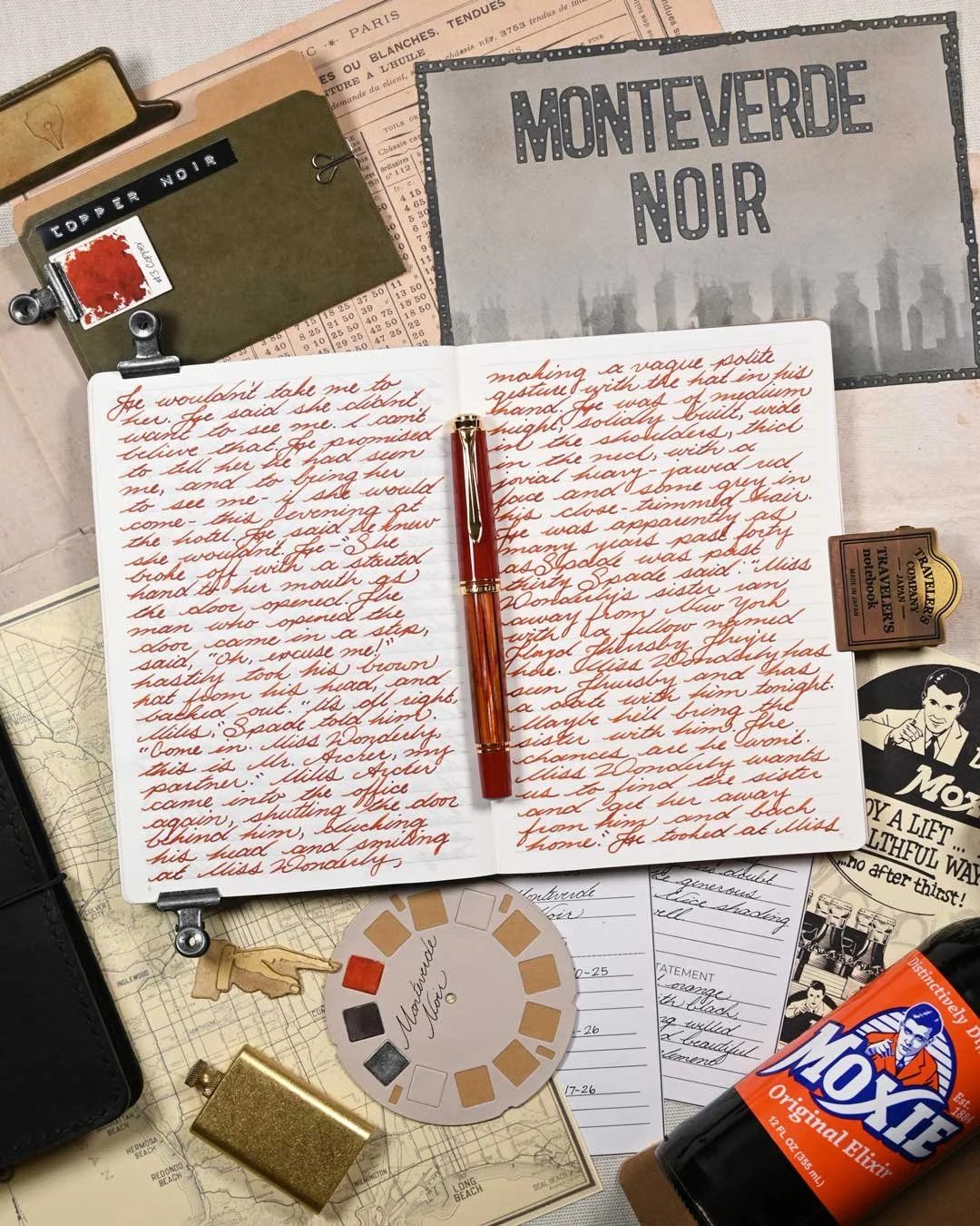 Monteverde Copper Noir writing sample flat lay