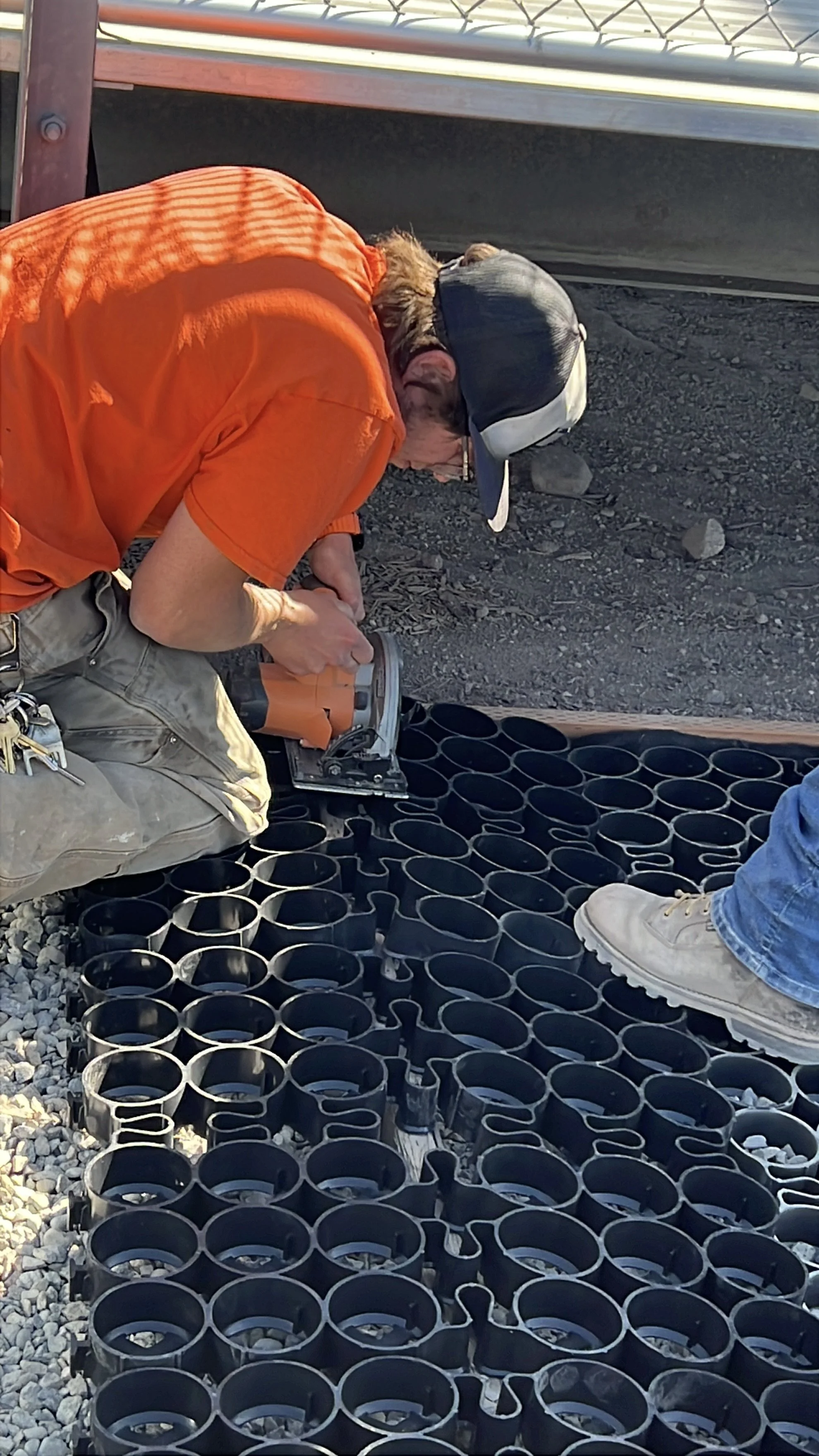 TrueGrid is laid out across the area and cut with a circular saw to fit the framed edge