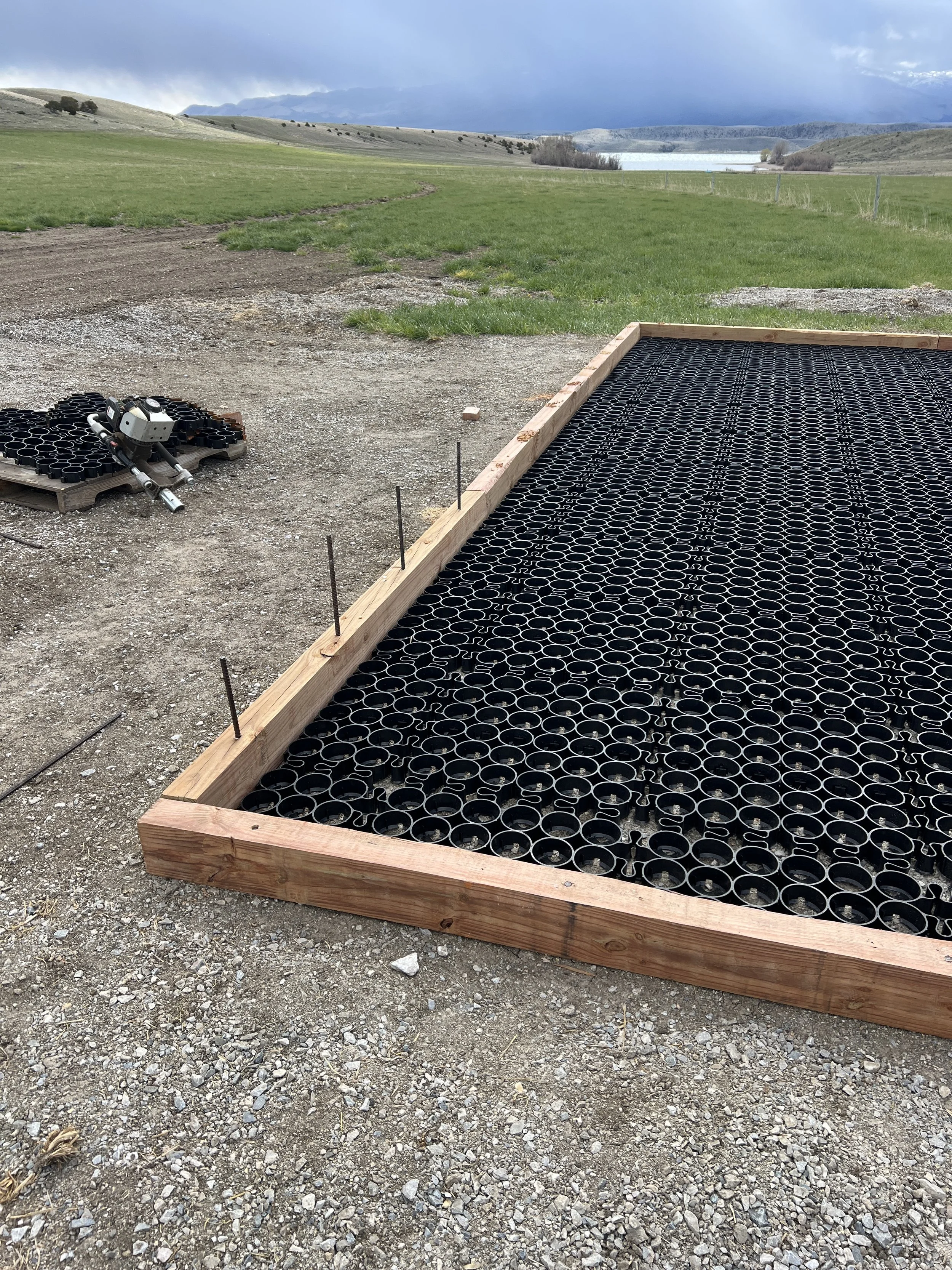 Rebar is pounded in with a combination of a gas-powered post pounder and a manual hammer