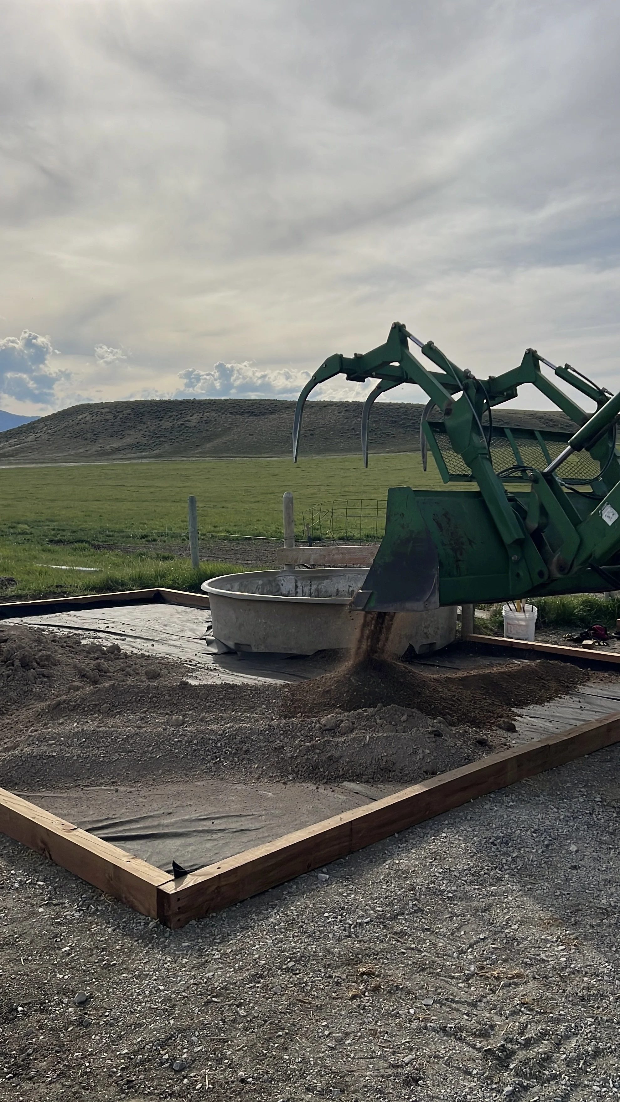 Road mix is dumped for the base layer prep