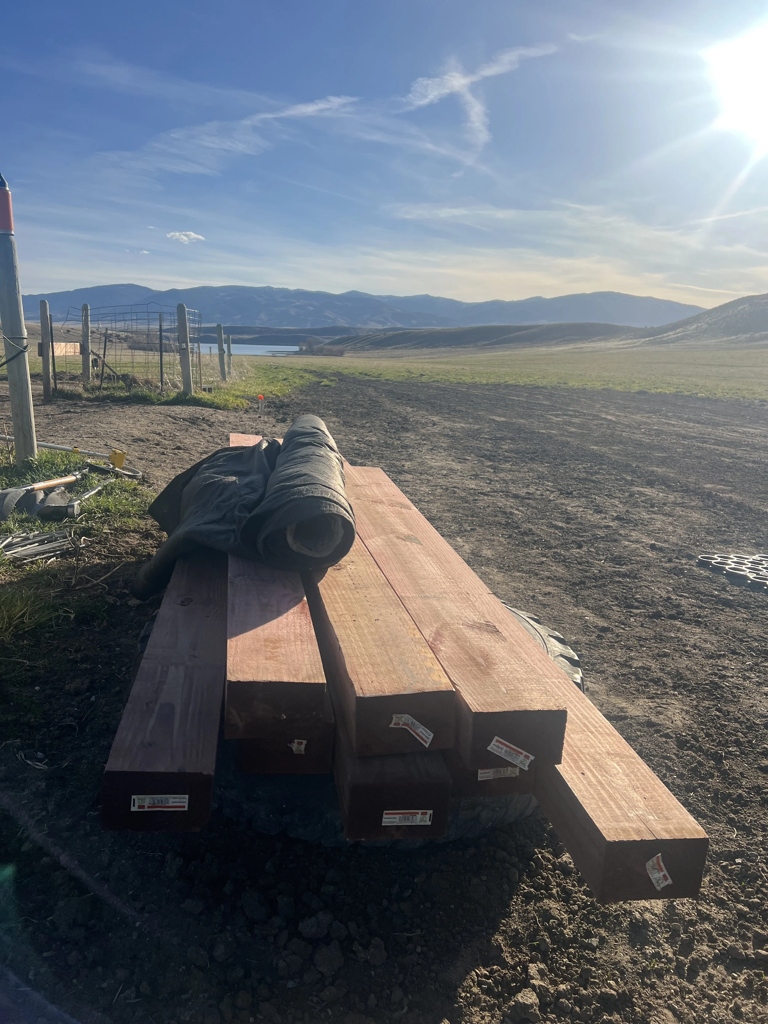 Materials include treated 4x6 lumber for the frame and Mirafi 140N fabric to keep the TrueGrid detention base and organic material separated