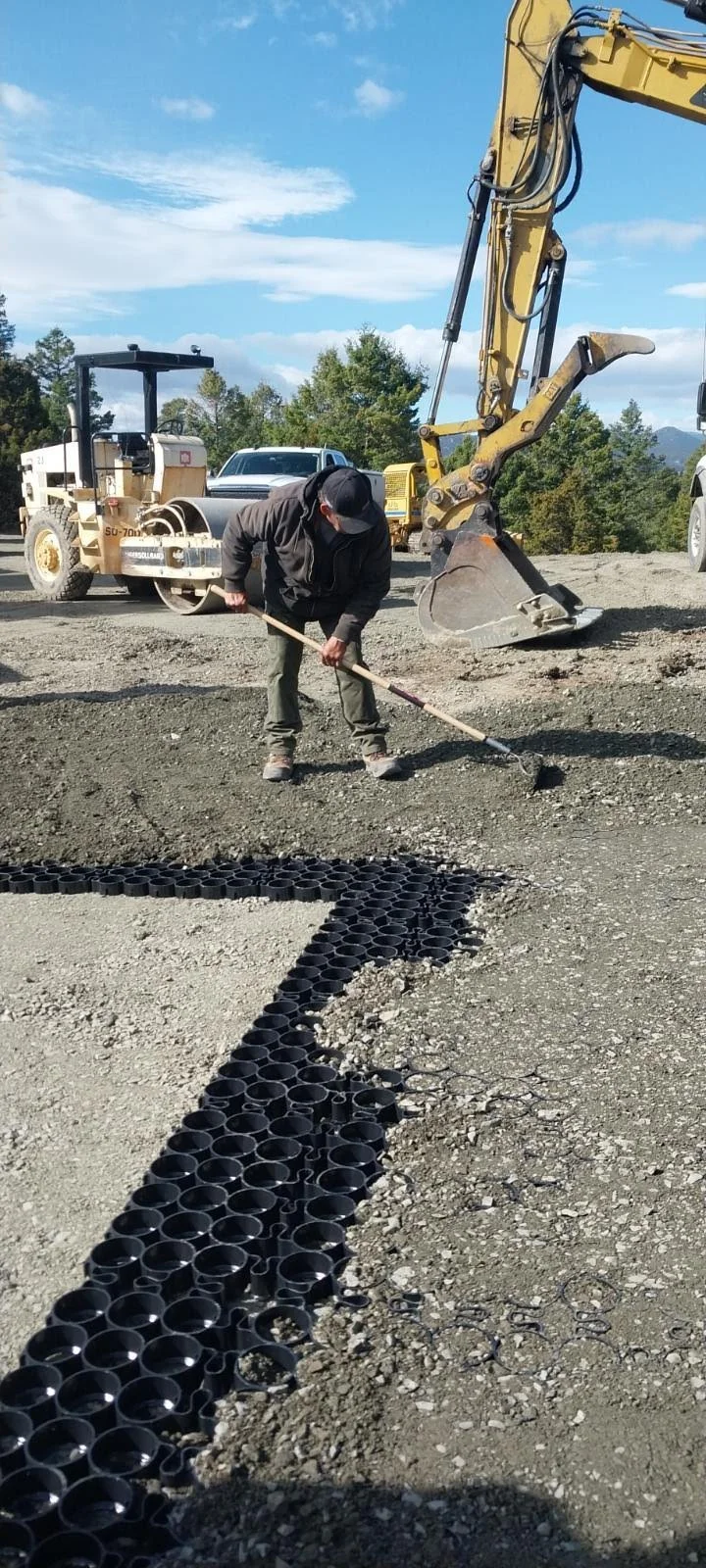 The crew raked angular aggregate into the cells