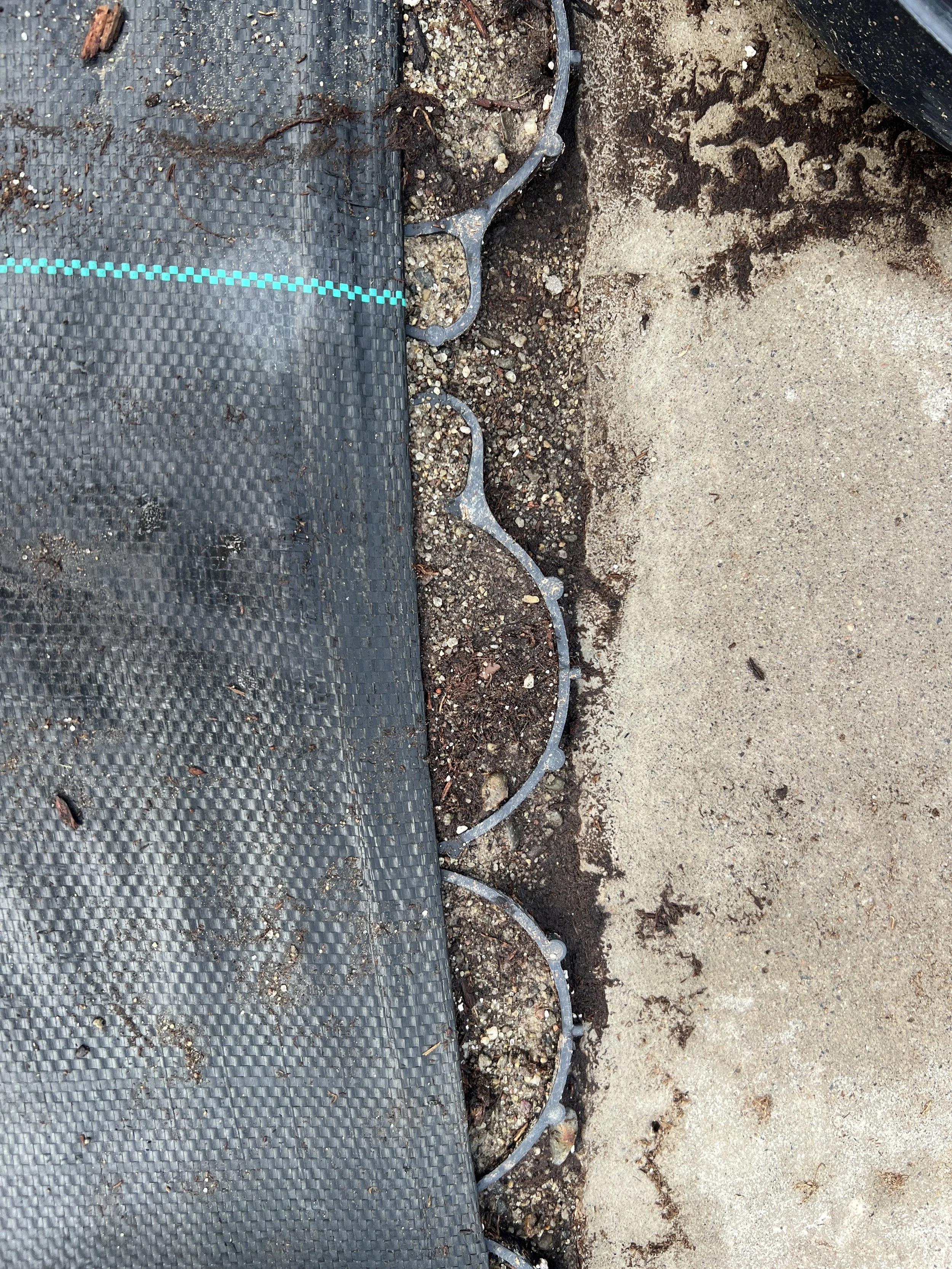 TrueGrid sits just below grade against the concrete center aisle, to protect the edge from constant wheel movement