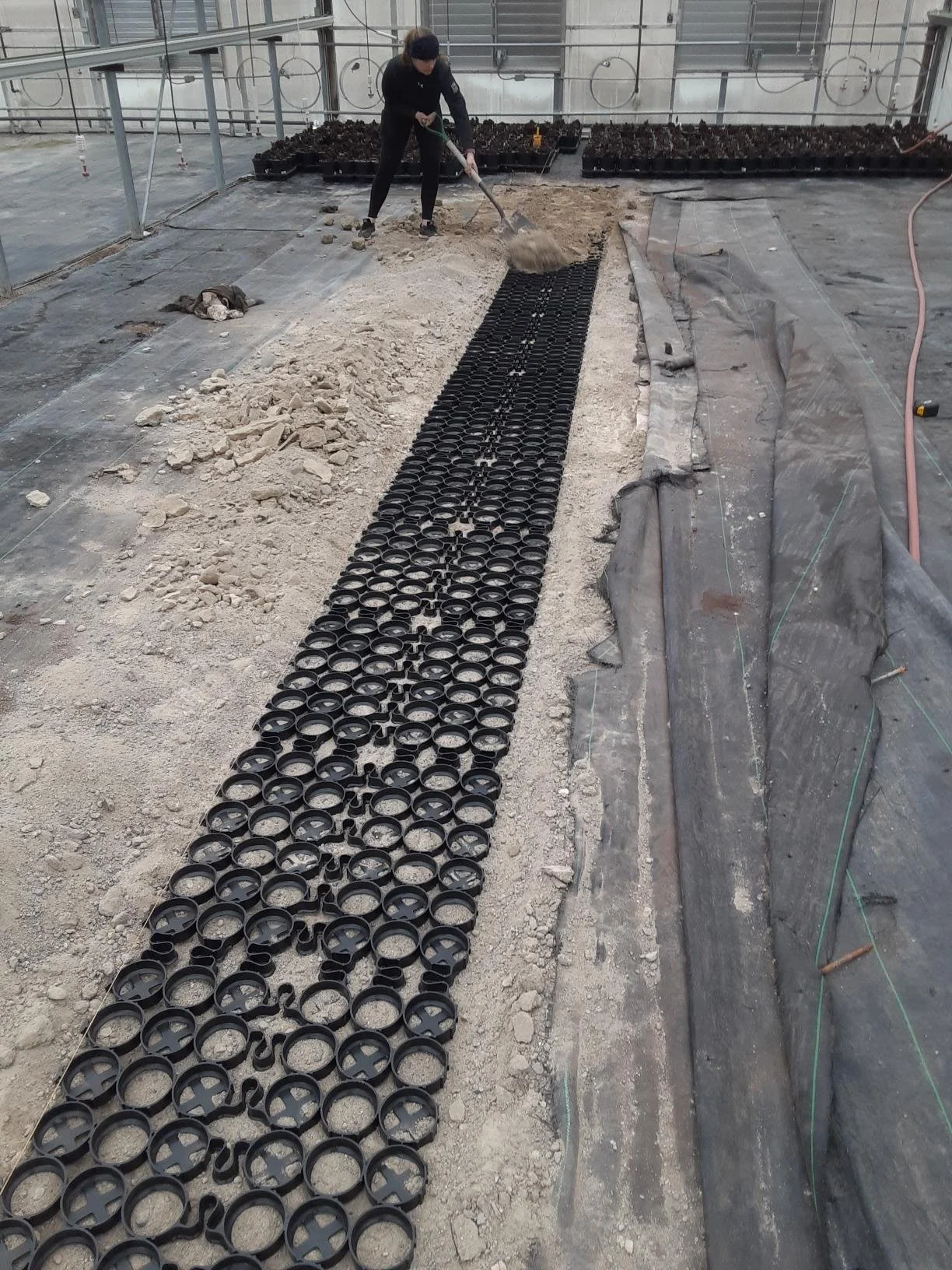 Recyled ground material is spread into the TrueGrid cells