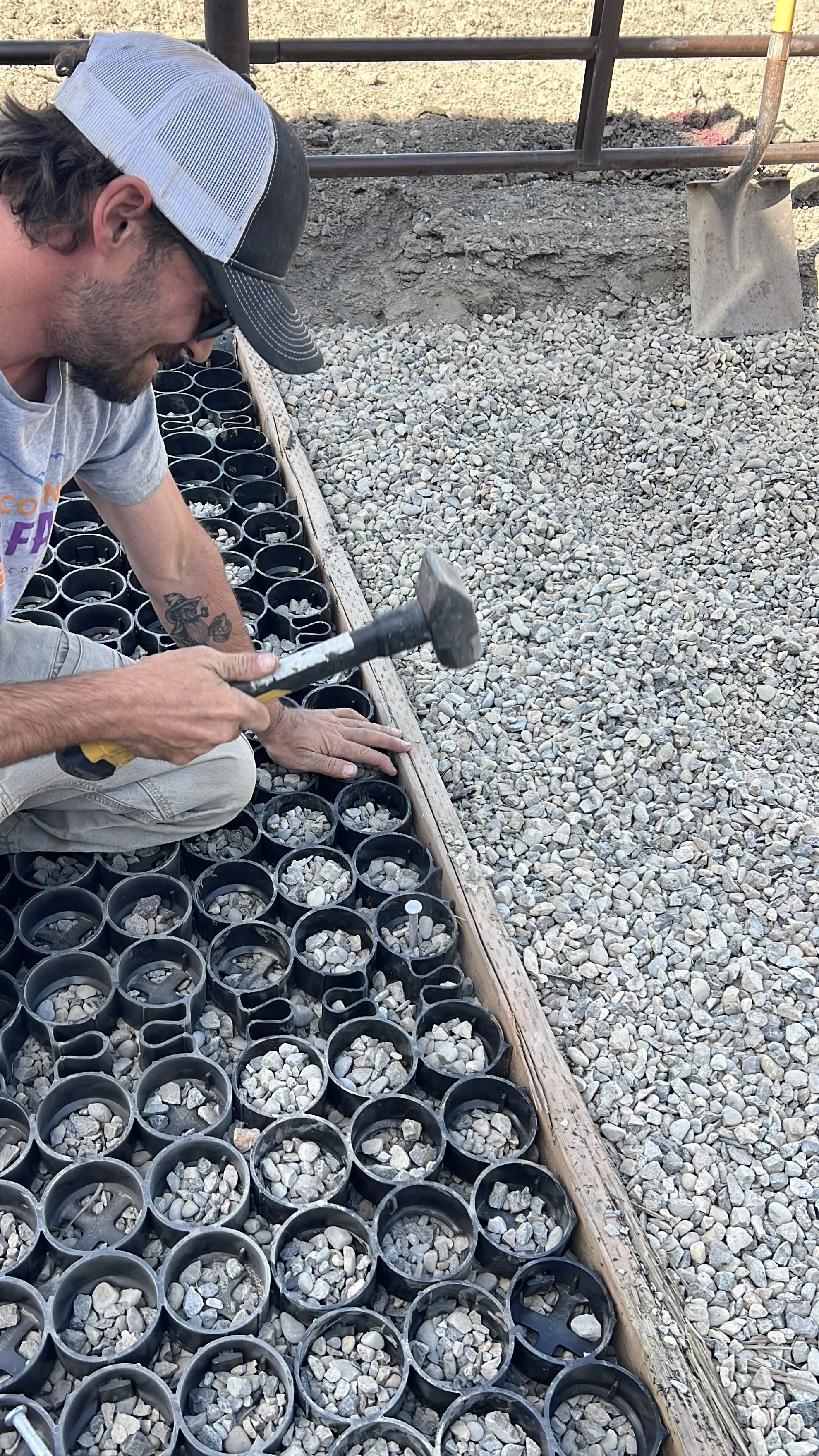 3/8 inch spikes are spaced approximately 10 feet apart along the edges and hammered into TrueGrid's X-anchors for extra security at high-traffic transitions (anchoring is not required on flat surfaces)