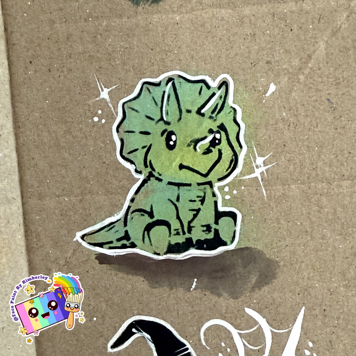 closeup-triceratops-stencil-design-in-face-paint