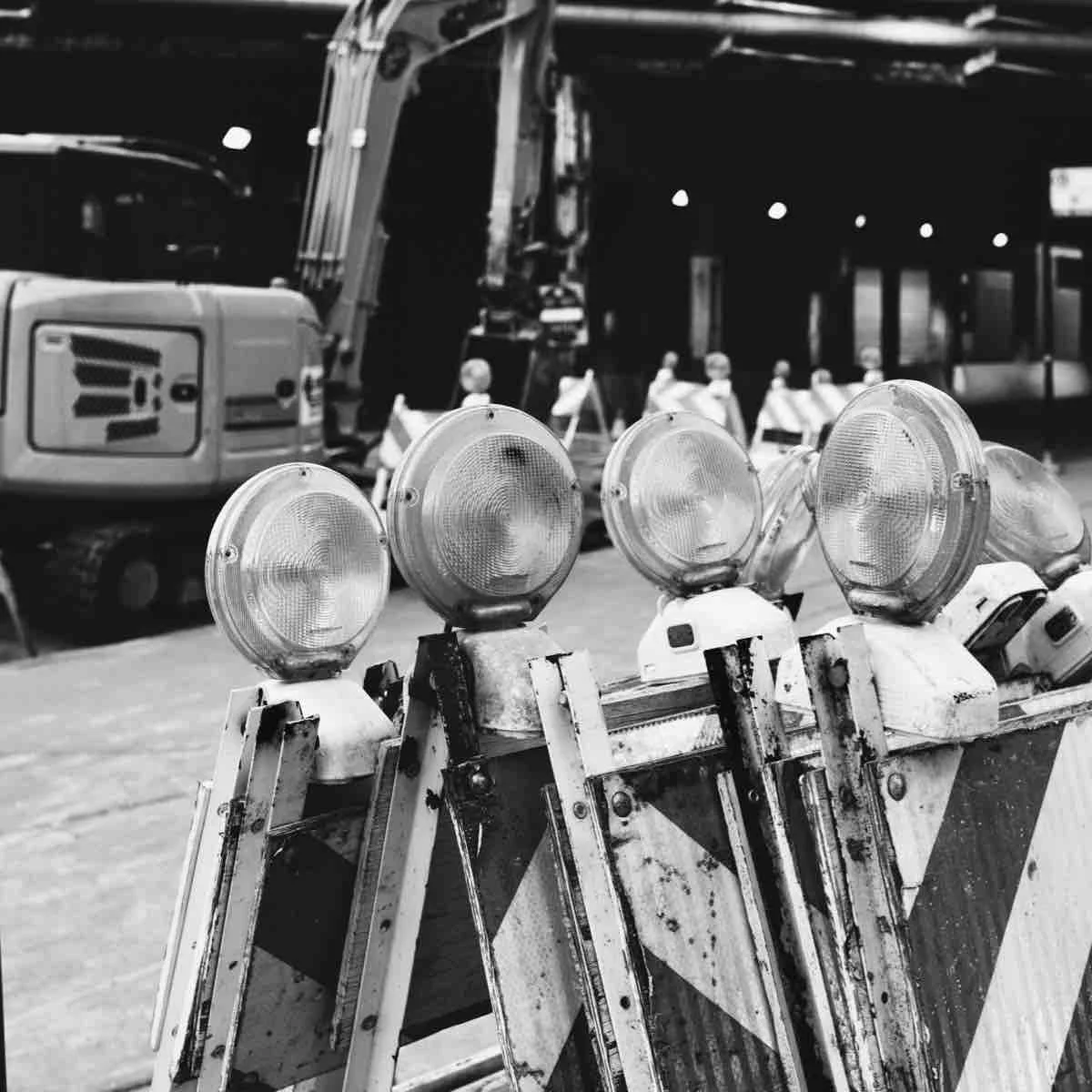 Construction site in the city streets, showing road blocks and heavy machinery