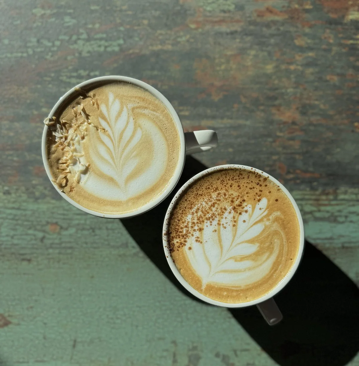 two lattes on a table