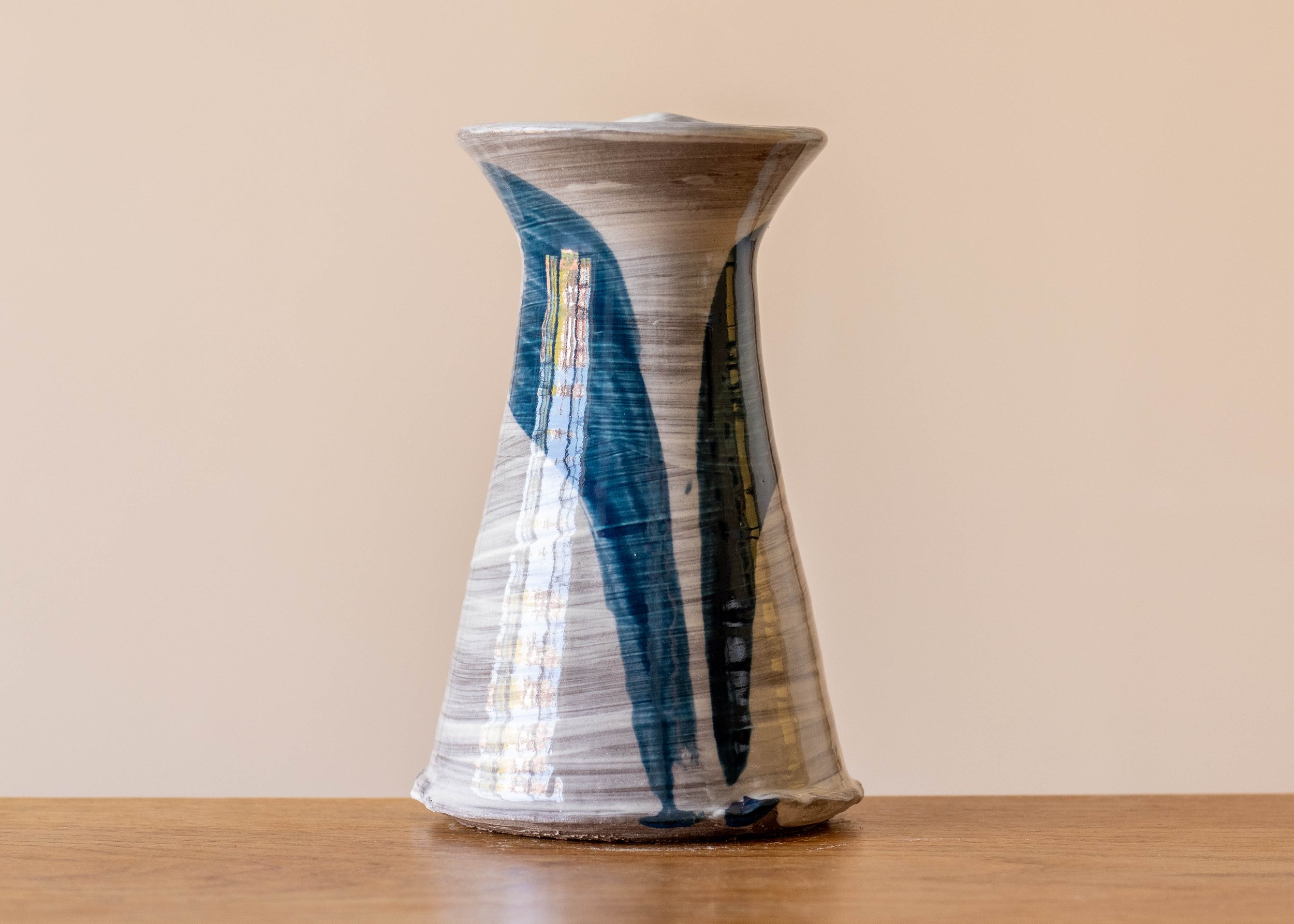 Small handmade stoneware vase with blue brushmarks #5, view of the front.jpg