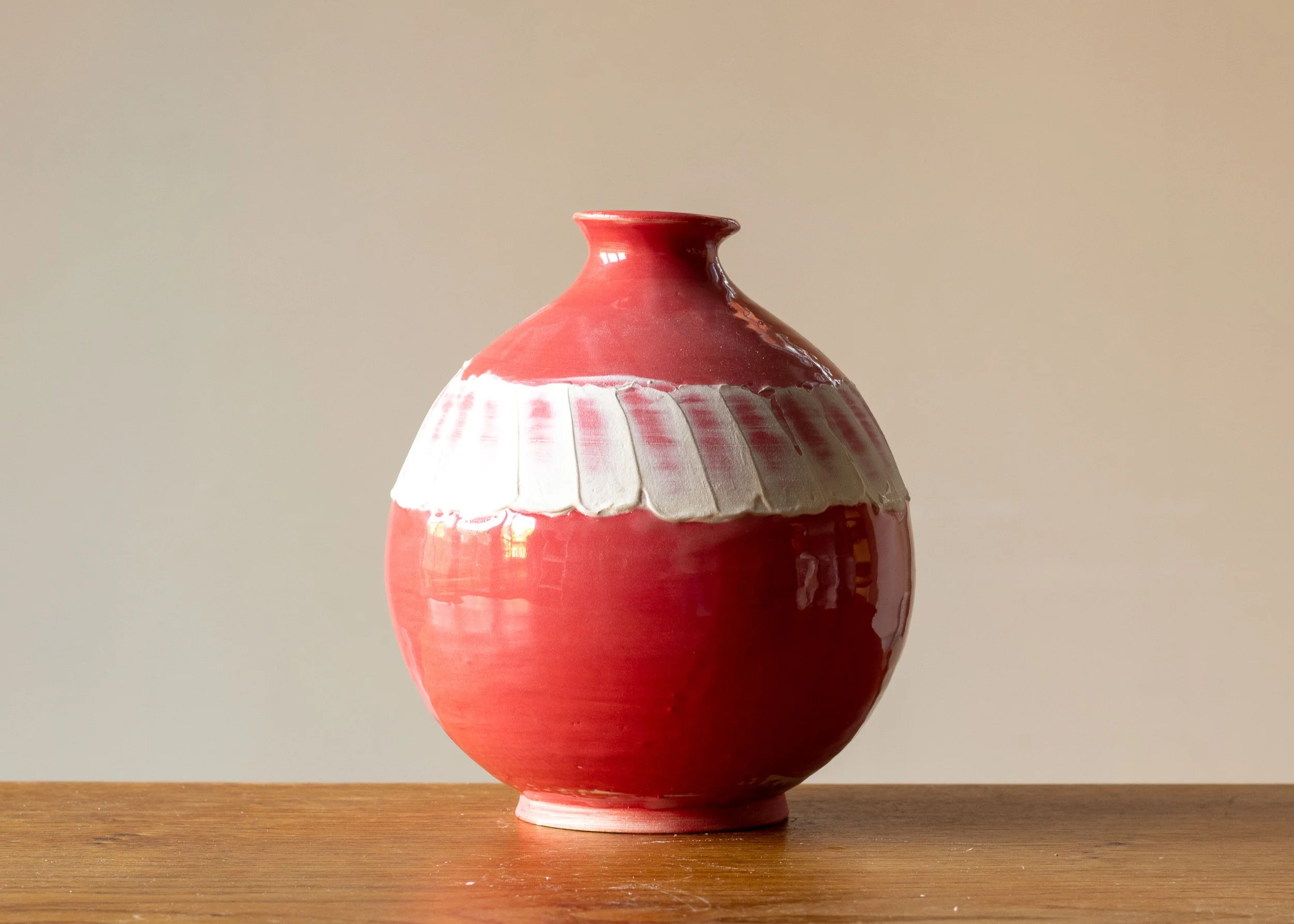 Medium Pale Red Moon Jar with White Decoration, side 3.jpg