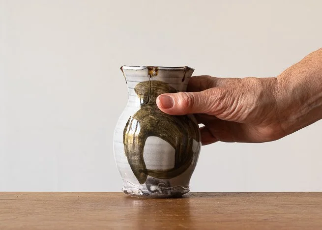 Bud Vase with Brown brush marks, with hand for scale.jpg