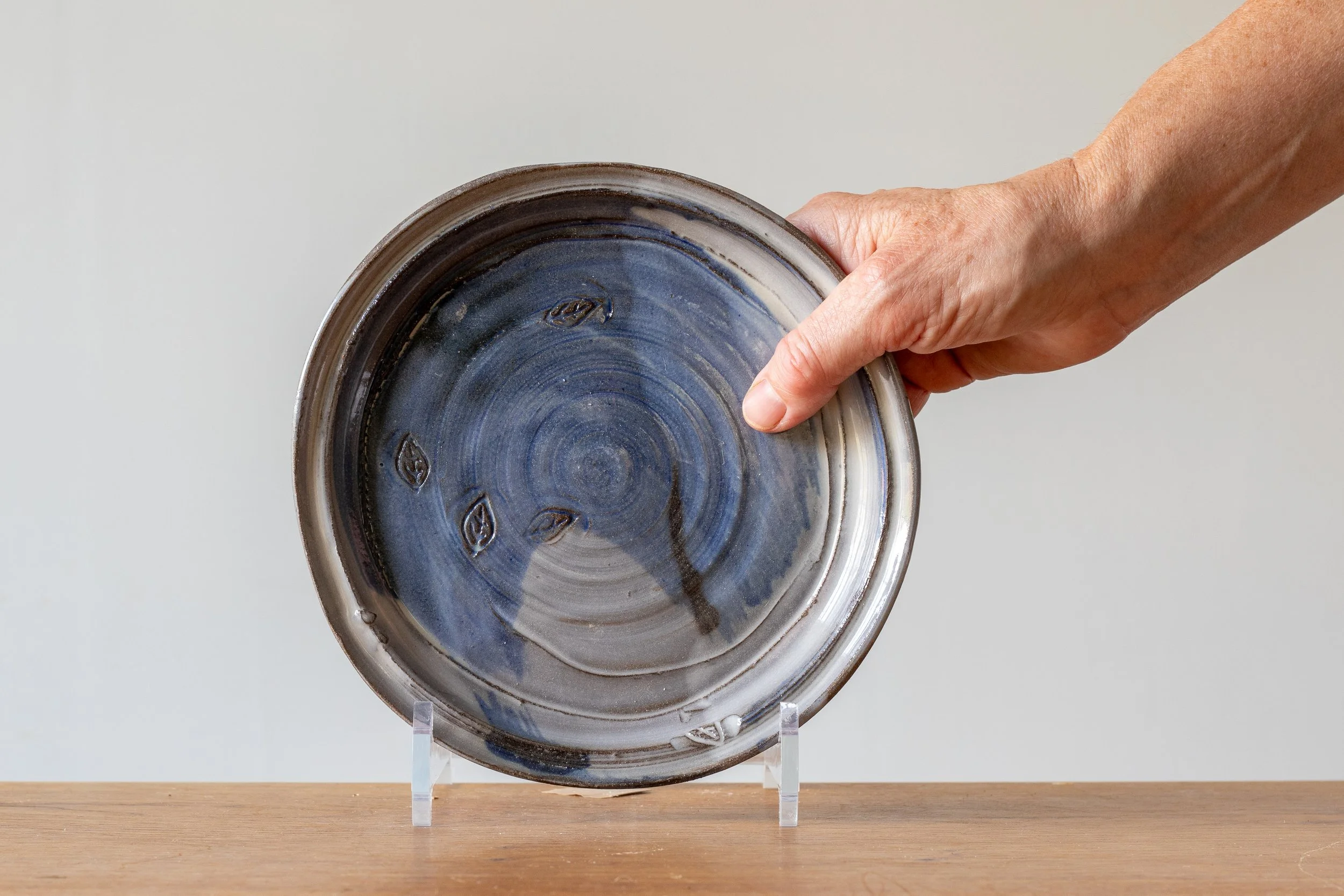Small Blue Handmade Pottery Plate, with hand for scale.jpg